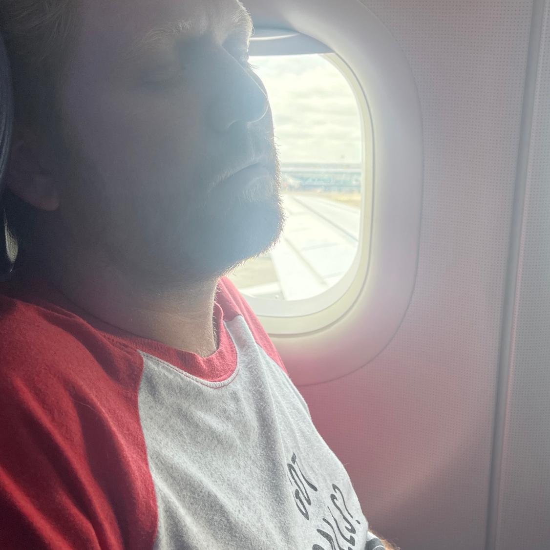 James excited to finally have a window seat on the way to Paris