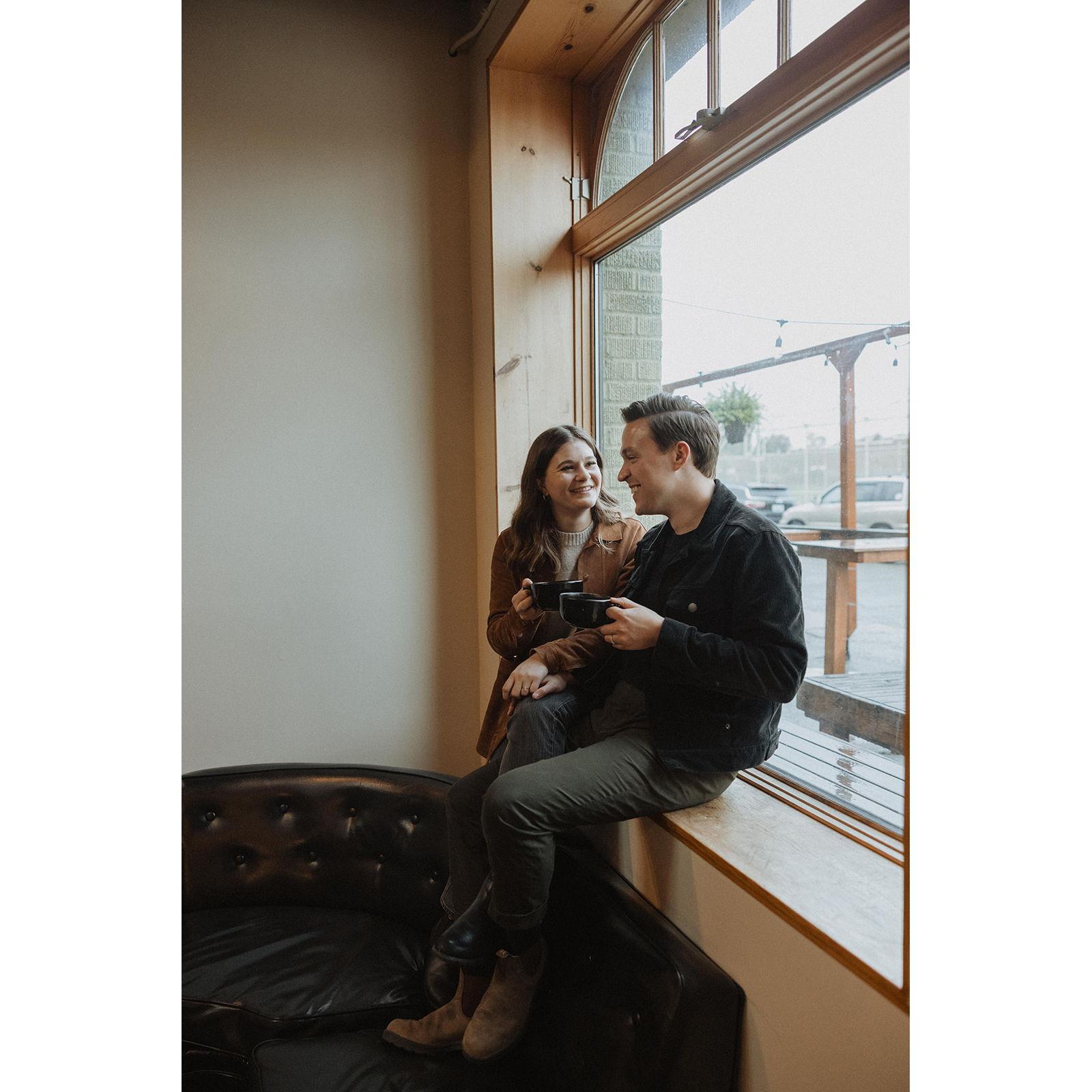 Engagement photos by In the Alpenglow at Bluebeard Coffee Roasters on a rainy day in Tacoma, Wahington in the fall of 2023.