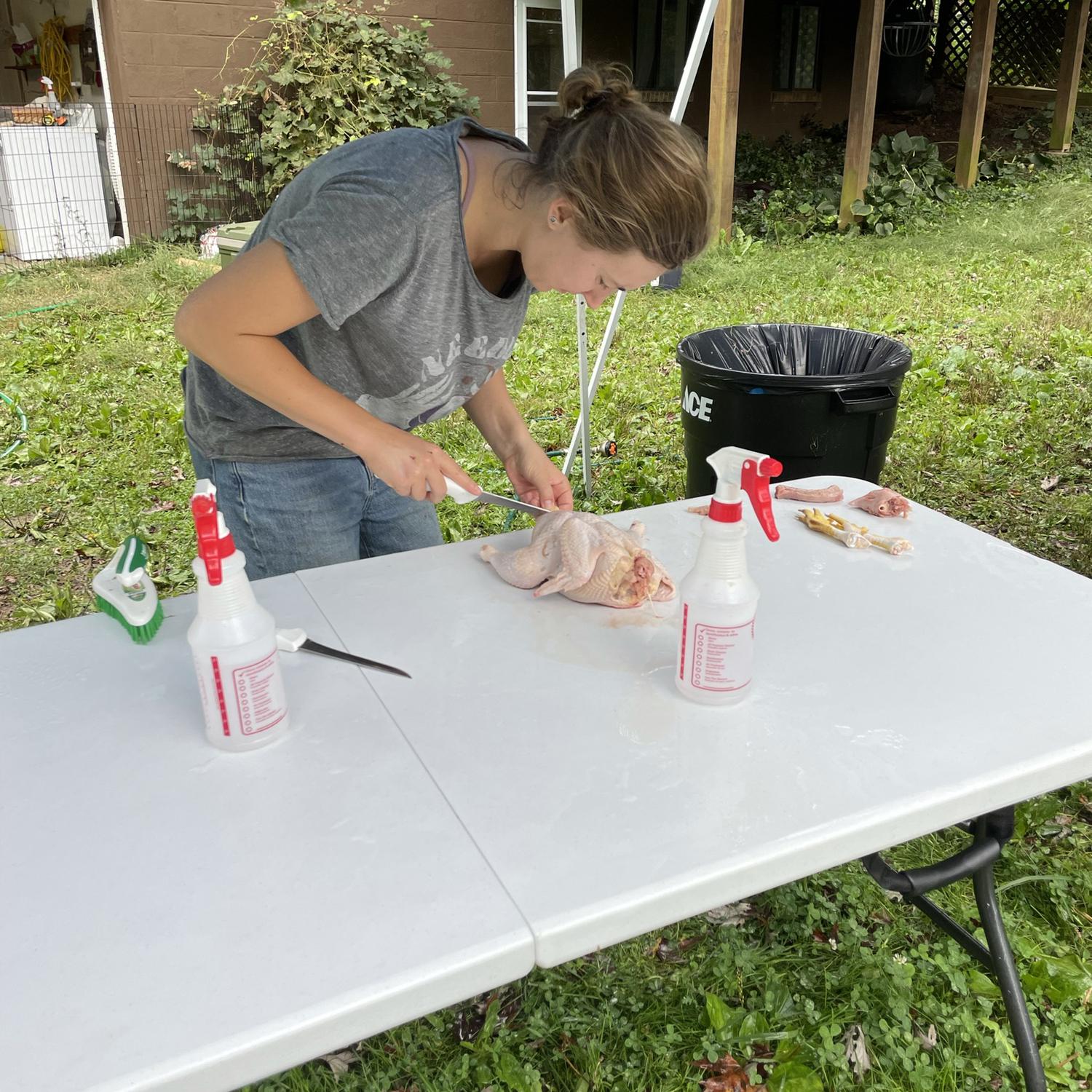 Morgan processing her first chicken!
