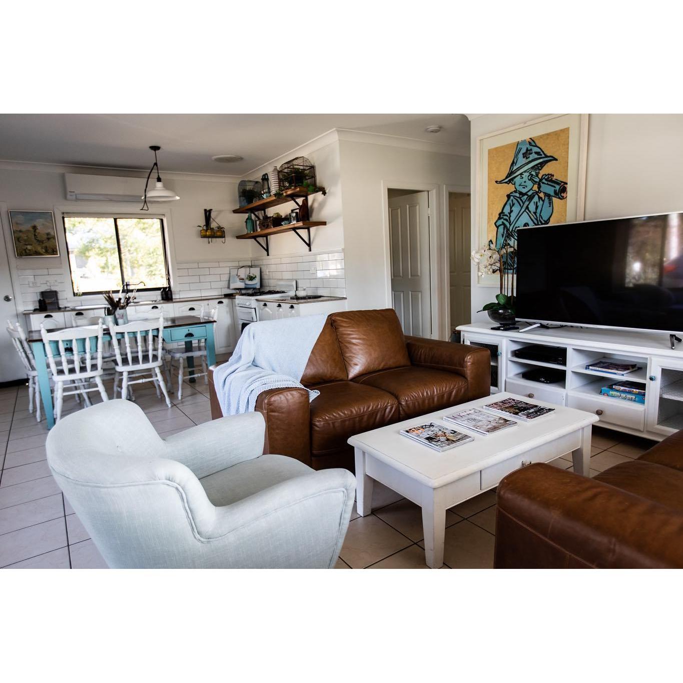 Loungeroom and kitchen in one of the cottages.
