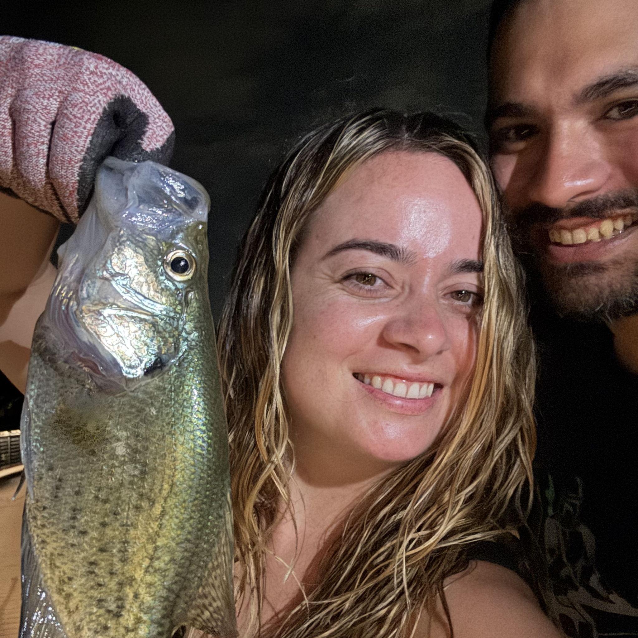 Nicole teaching Steven how to fish