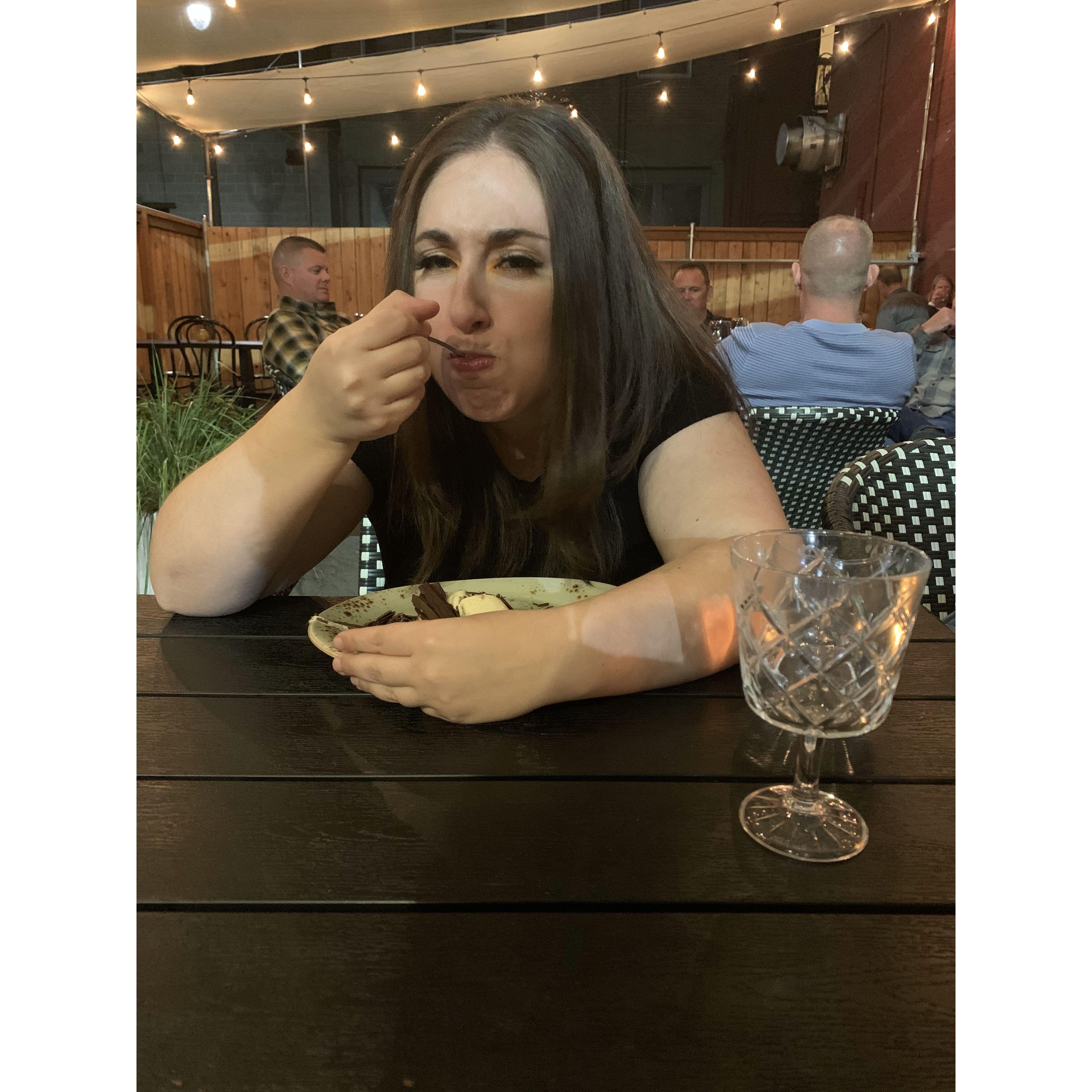 Sylvana guarding her dessert after the first bite. Yes, it really is that good!