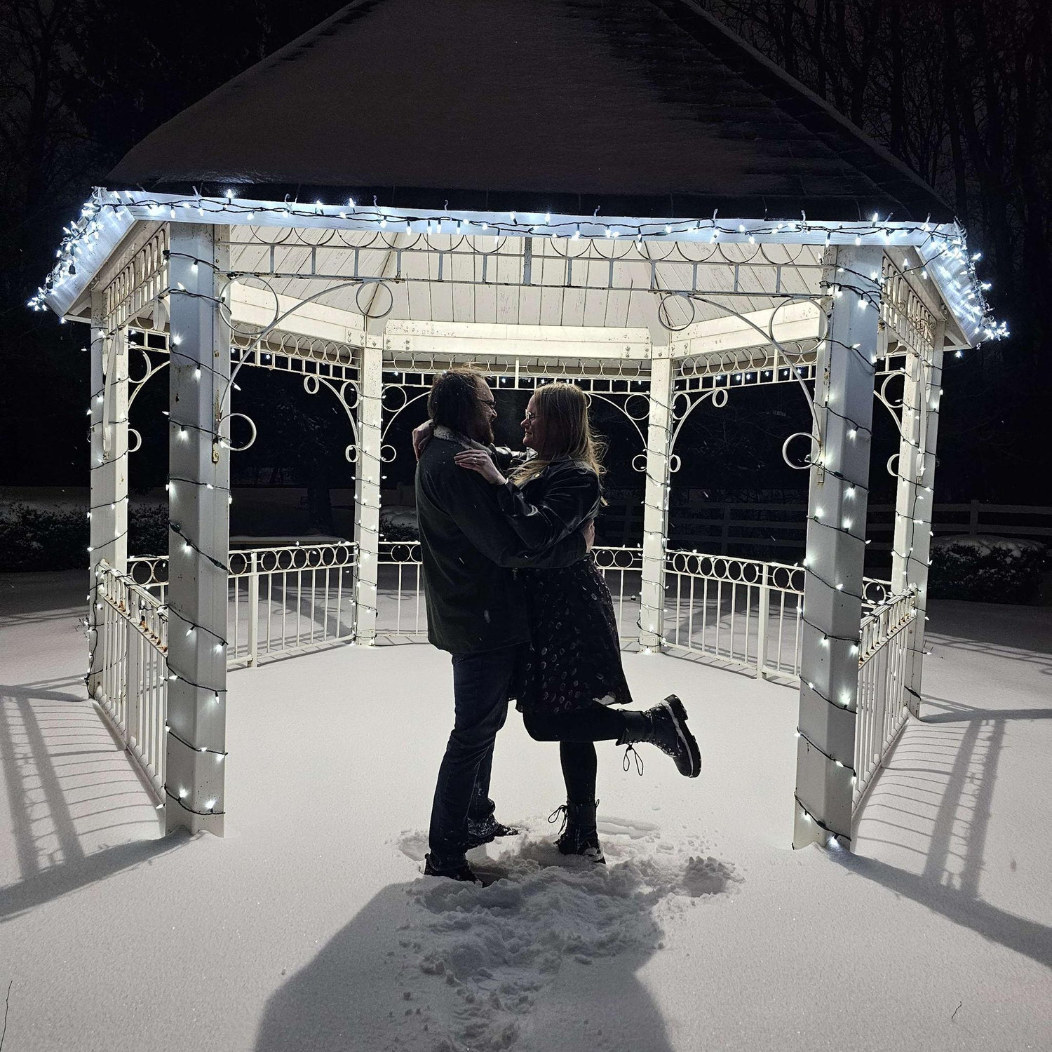 One of our engagement photos. It was in the negatives, but we couldn't resist the beautiful Christmas light decorations in the park and gazebos.