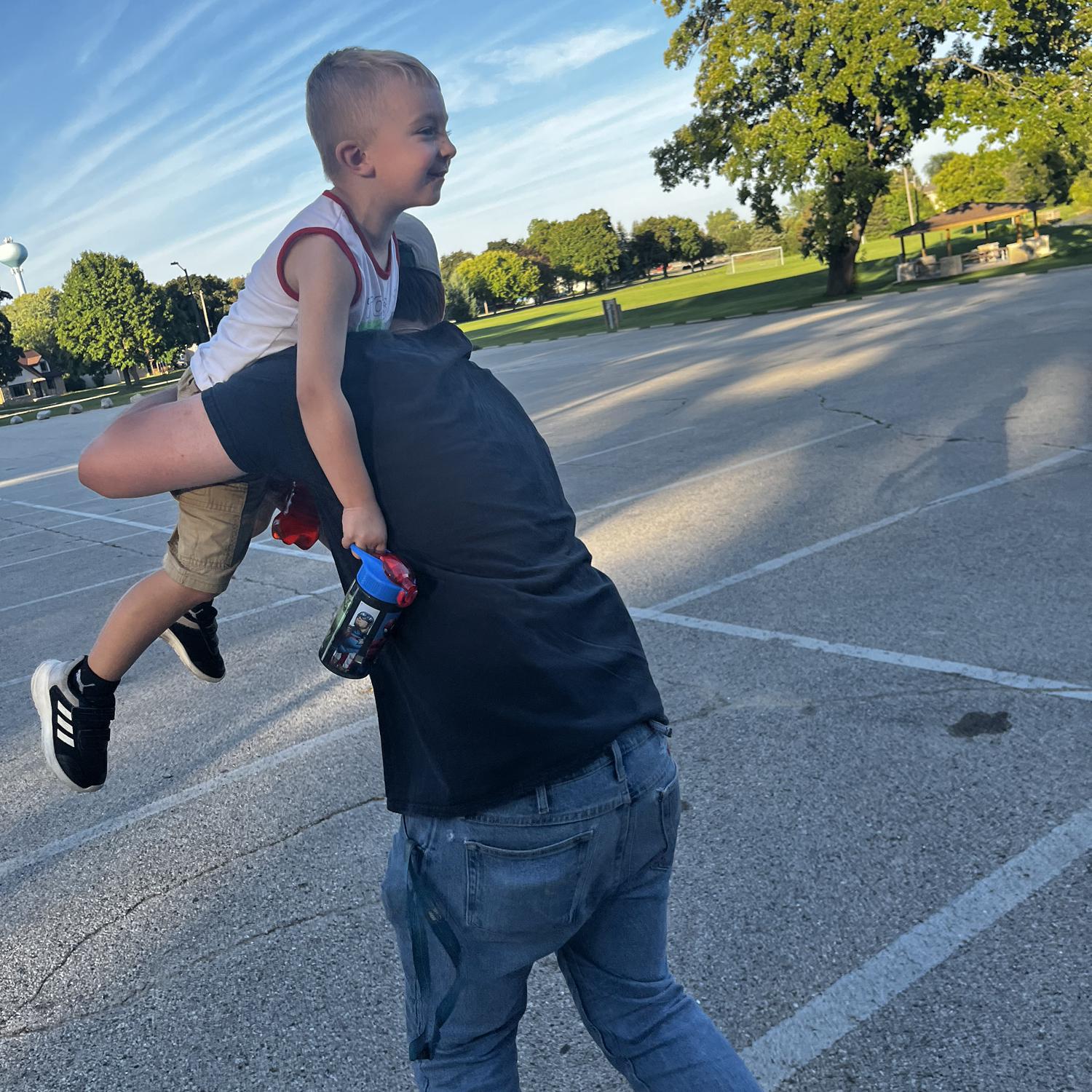 Uncle Justin carrying Mason to the park