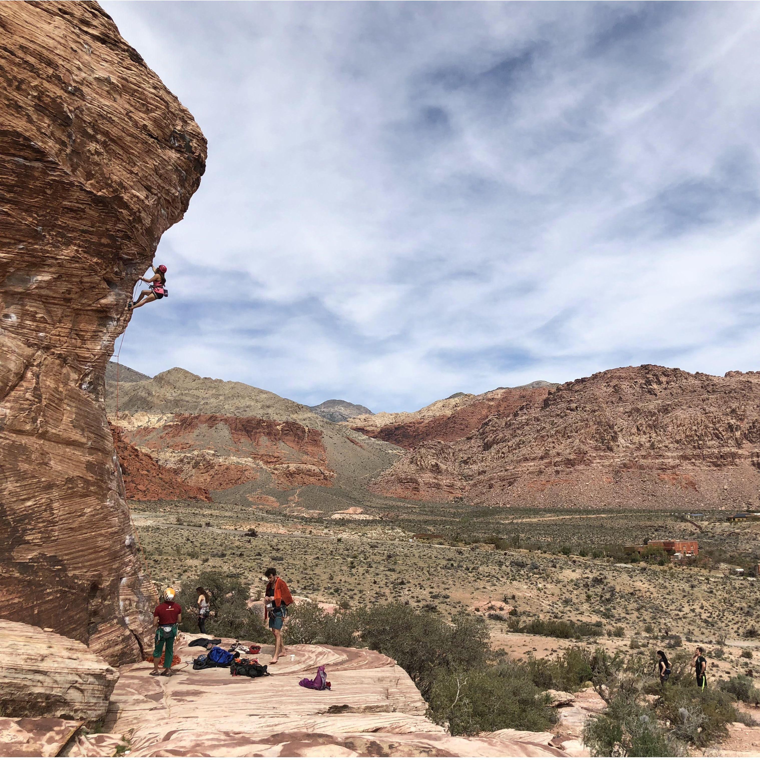 The climbing pink dot is Amira, belayed by the lovely Teddy!