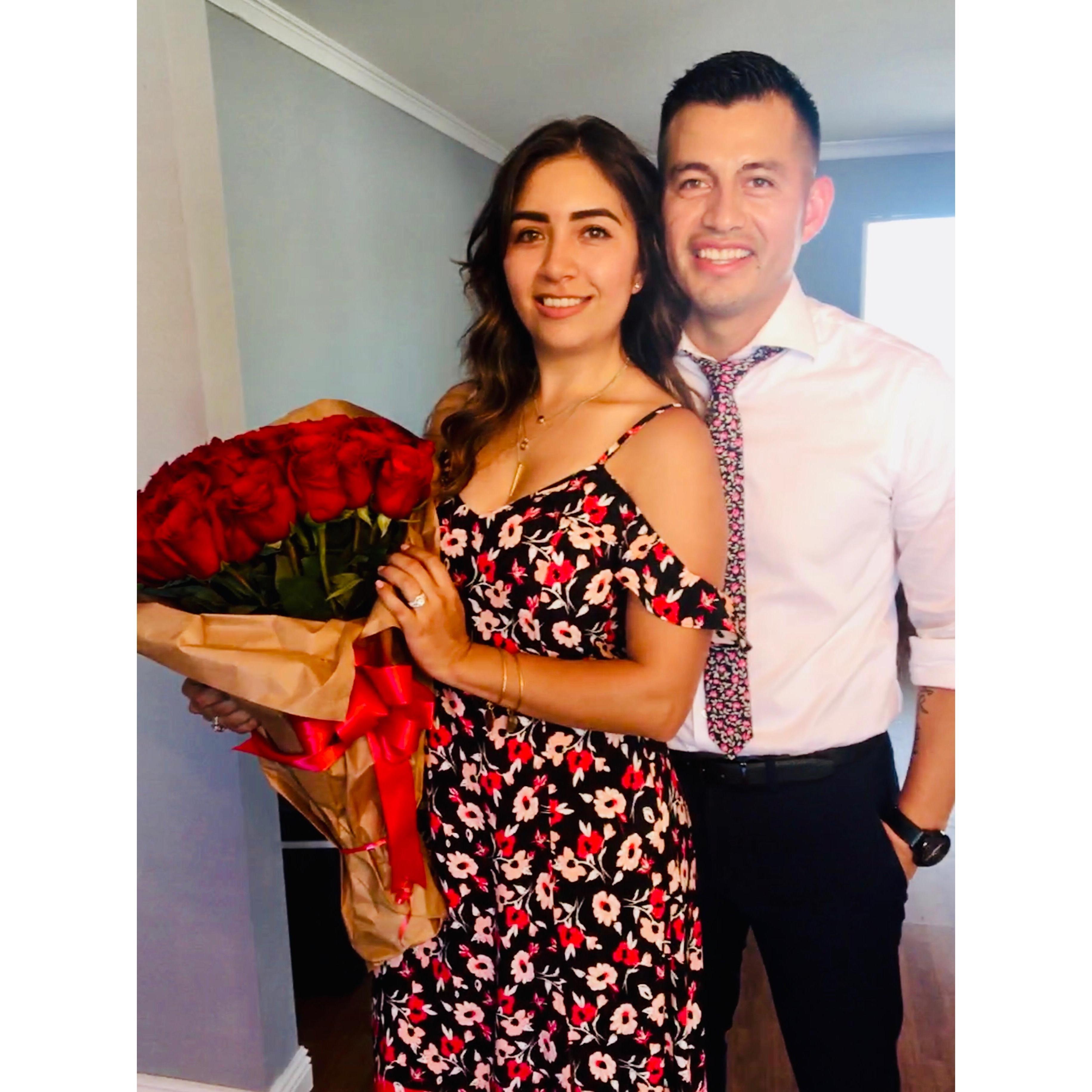 A photo taken of us the day of our engagement. Flowers on flowers on flowers.