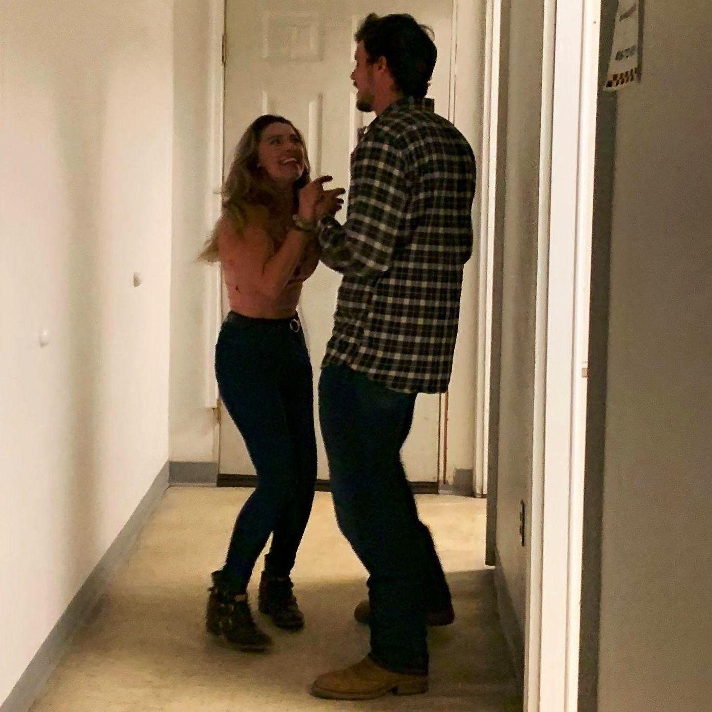 Dancing in the hallway at a karaoke bar