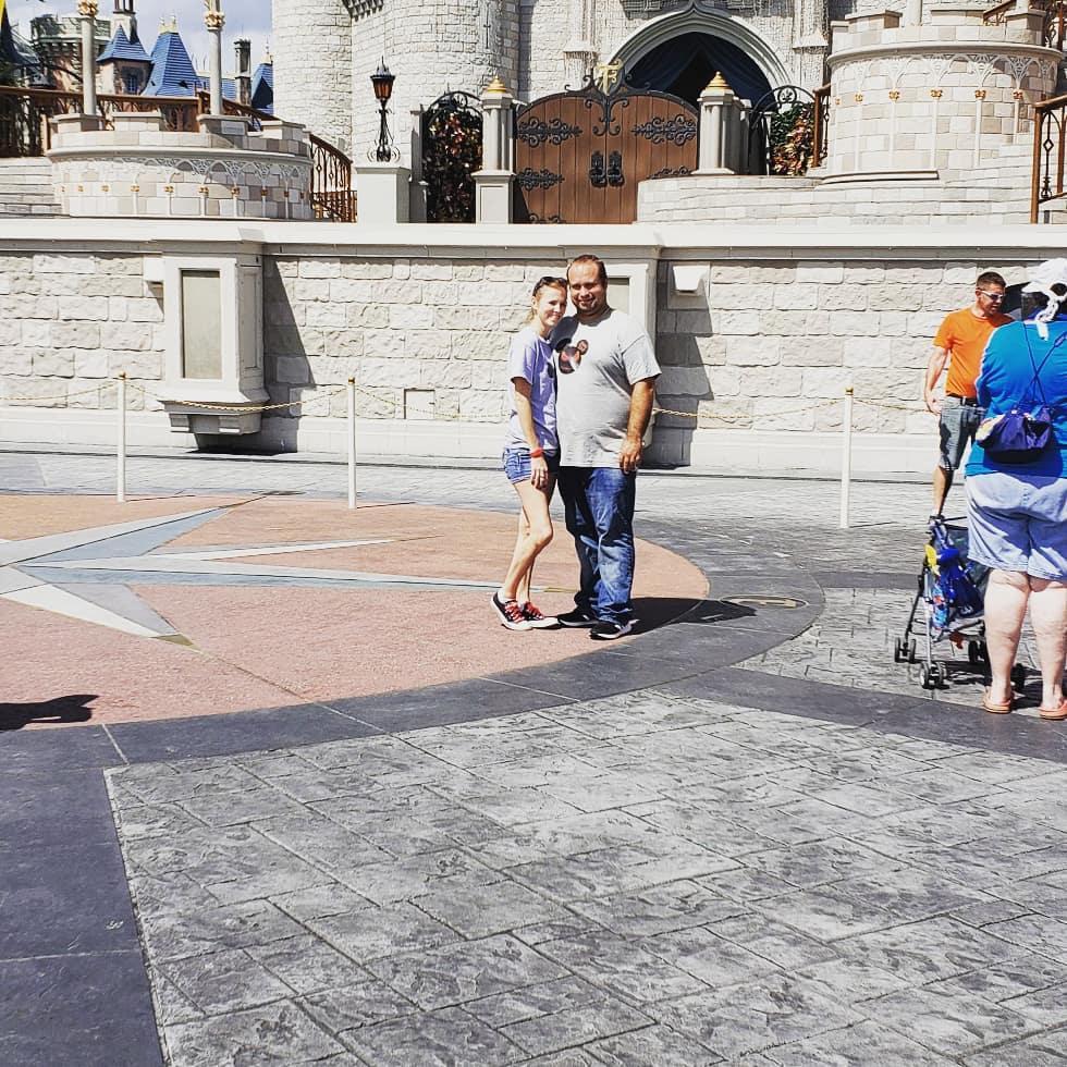 He proposed at Disney World, in front of Cinderella's Castle!!