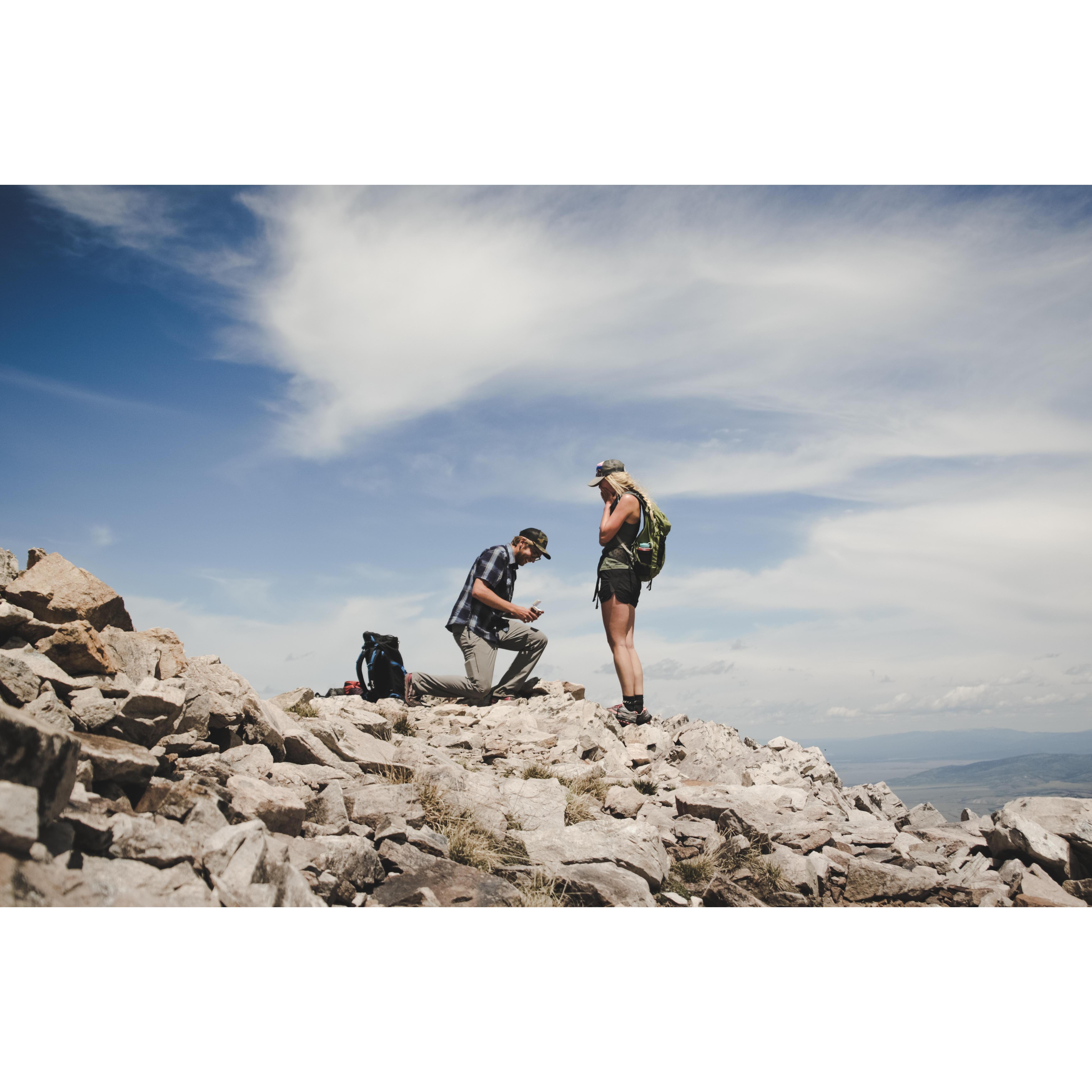July 17, 2019-The proposal! Atop the first mountain we climbed and skied in the backcountry together in March 2018: Jackson Peak.