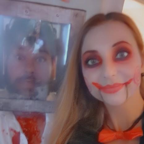 We love an excuse to wear a costume! This was our first Halloween together - Billy the Saw puppet and one of its victims