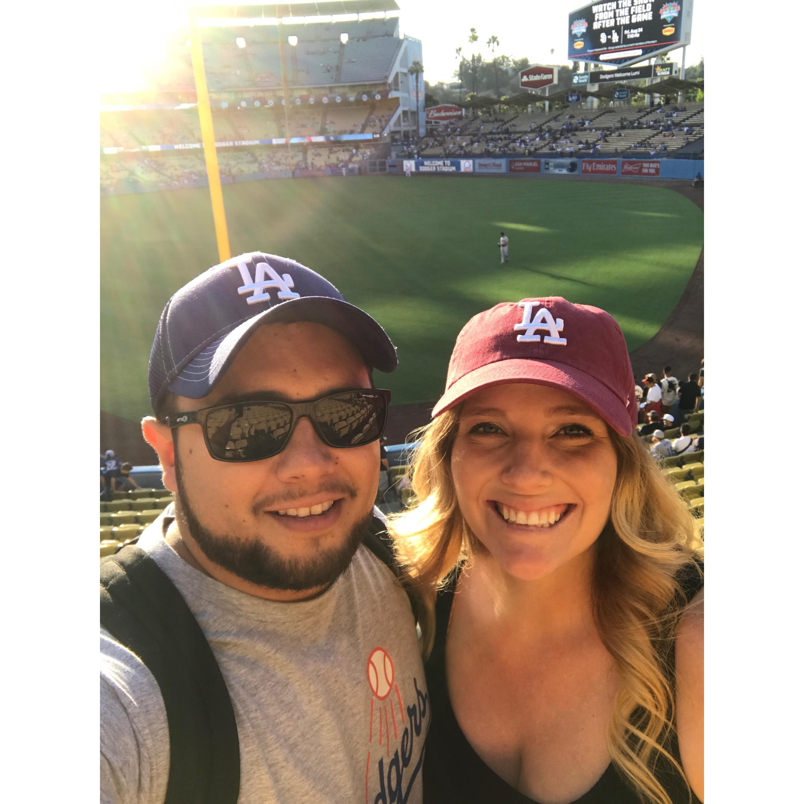 Carolyn was coming up on 7 months pregnant at this Dodger game with Gabe, Gabe surprised her with tickets so she could see them play one last time before Addison arrived!