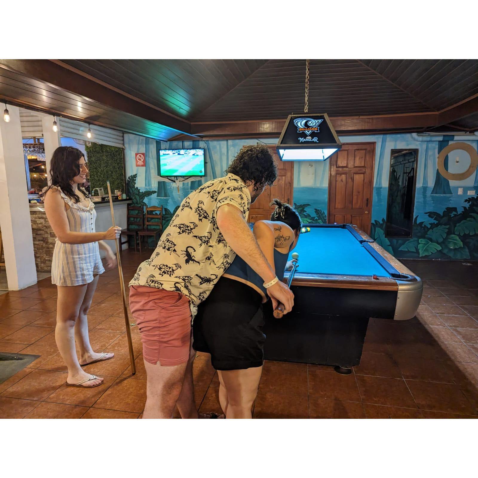 This photo is misleading - Katie is better at pool than Zach