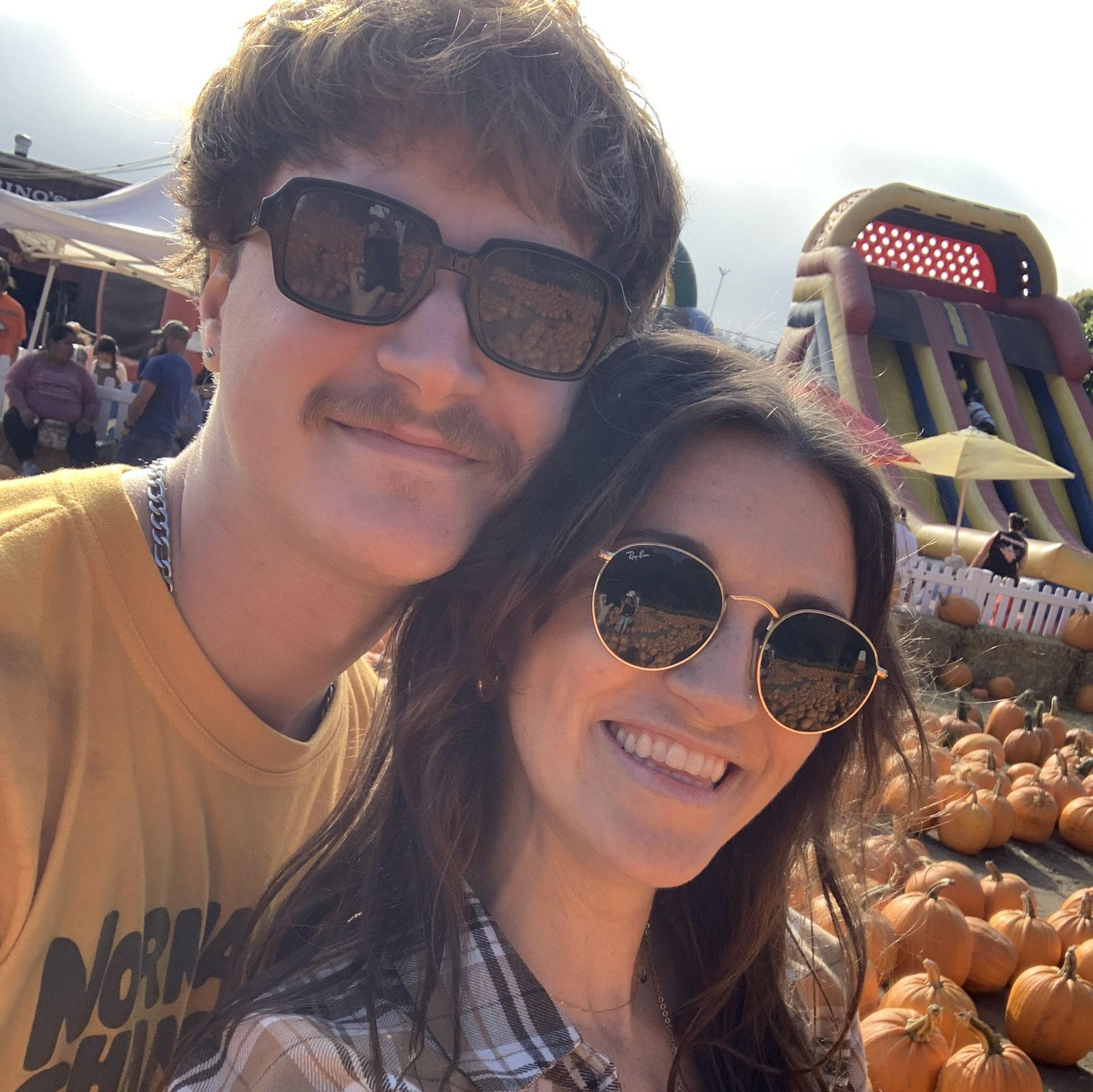 Picking pumpkins at Lemos Farm in Half Moon Bay, the same location where Amanda experienced her very first pony ride (2023).