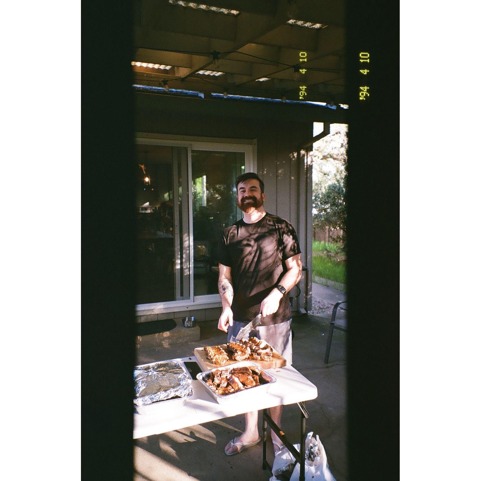 David making Chloe's Dad's famous bbq ribs for her birthday!