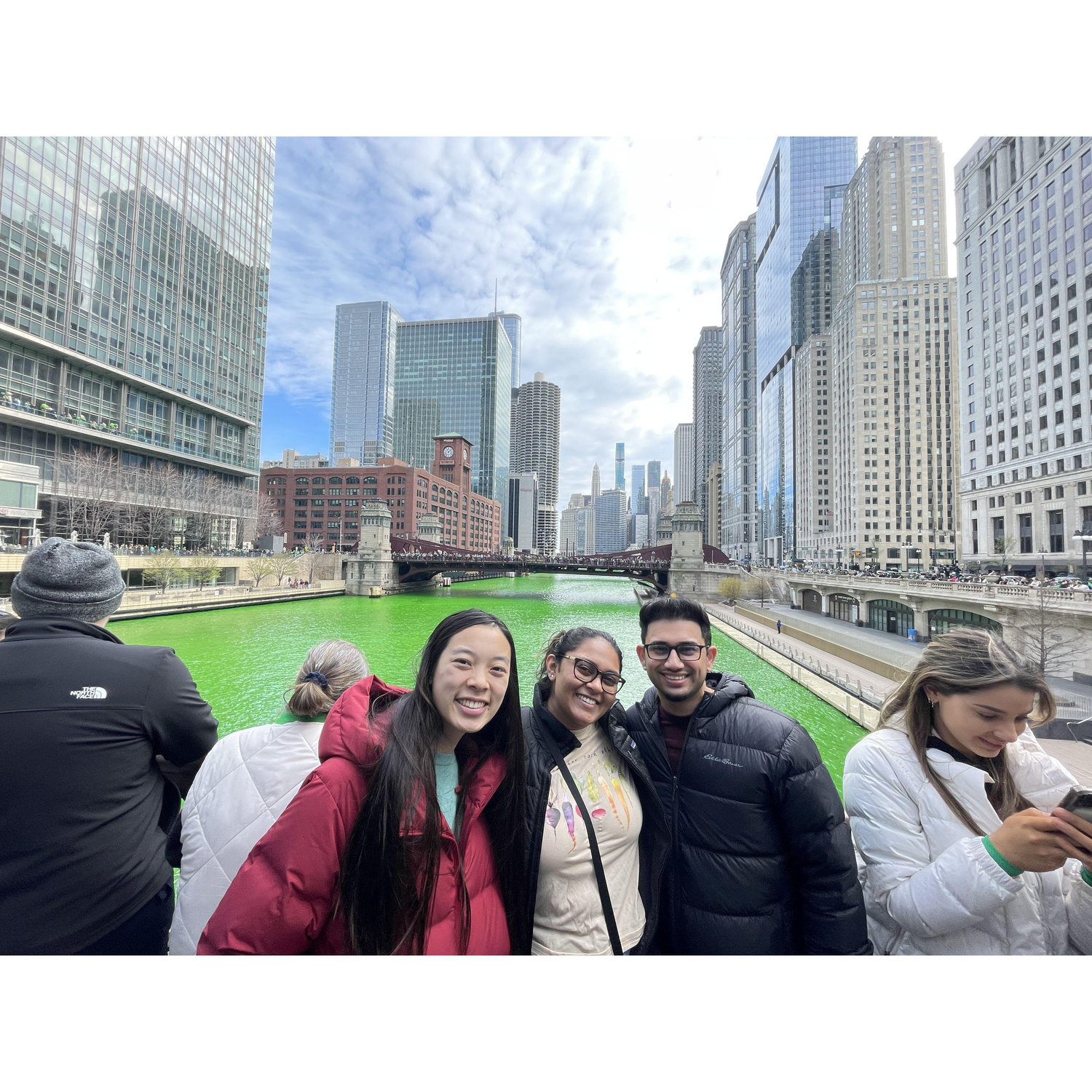 Kaitlin, Shivani, and Arjun on the Chicago River during St. Patricks River Dyeing