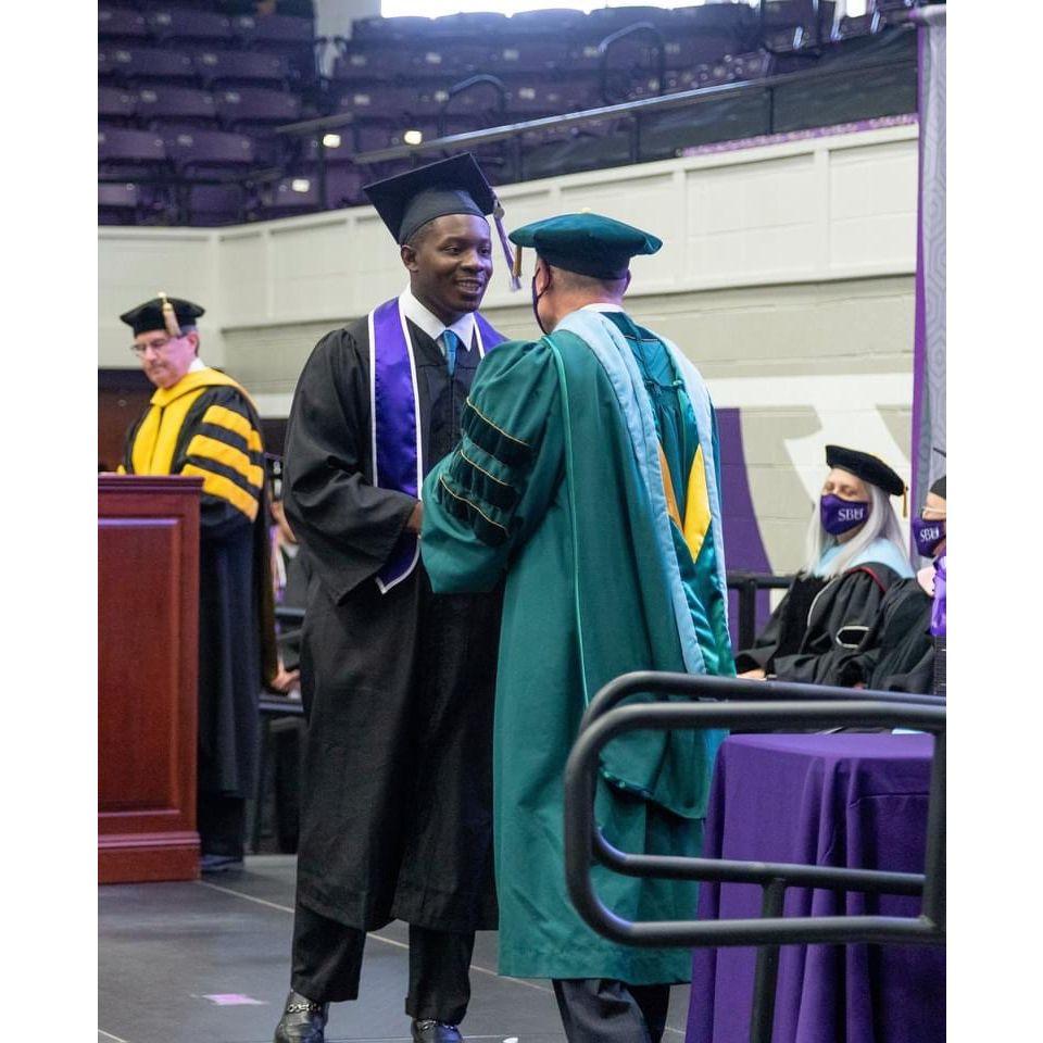 Jordan receiving his diploma