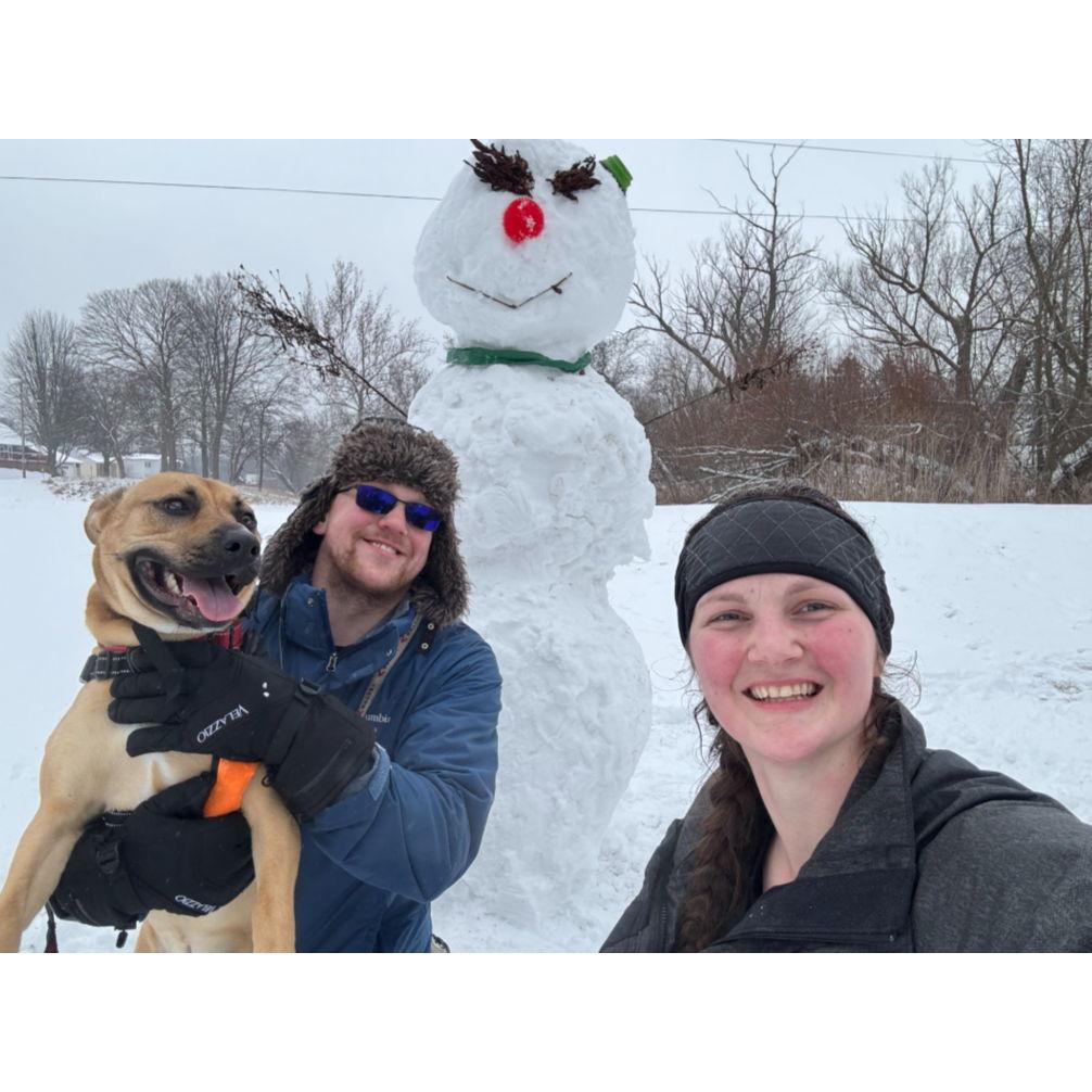 Us with our 8ft tall snowman. Rosie very graciously allowed us to borrow her ball for its nose.