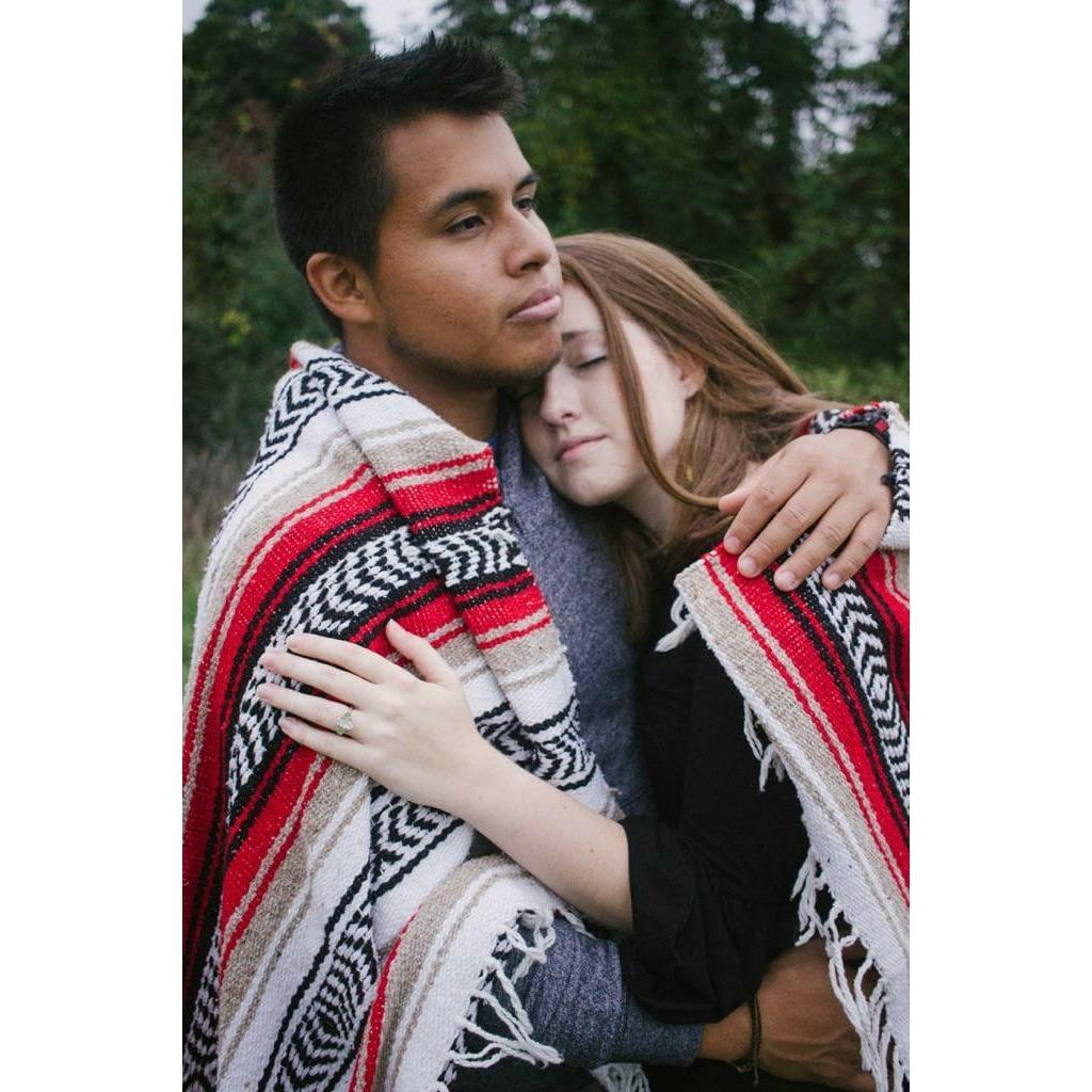 We find refuge in each other's arms. This was taken during our engagement photo shoot!