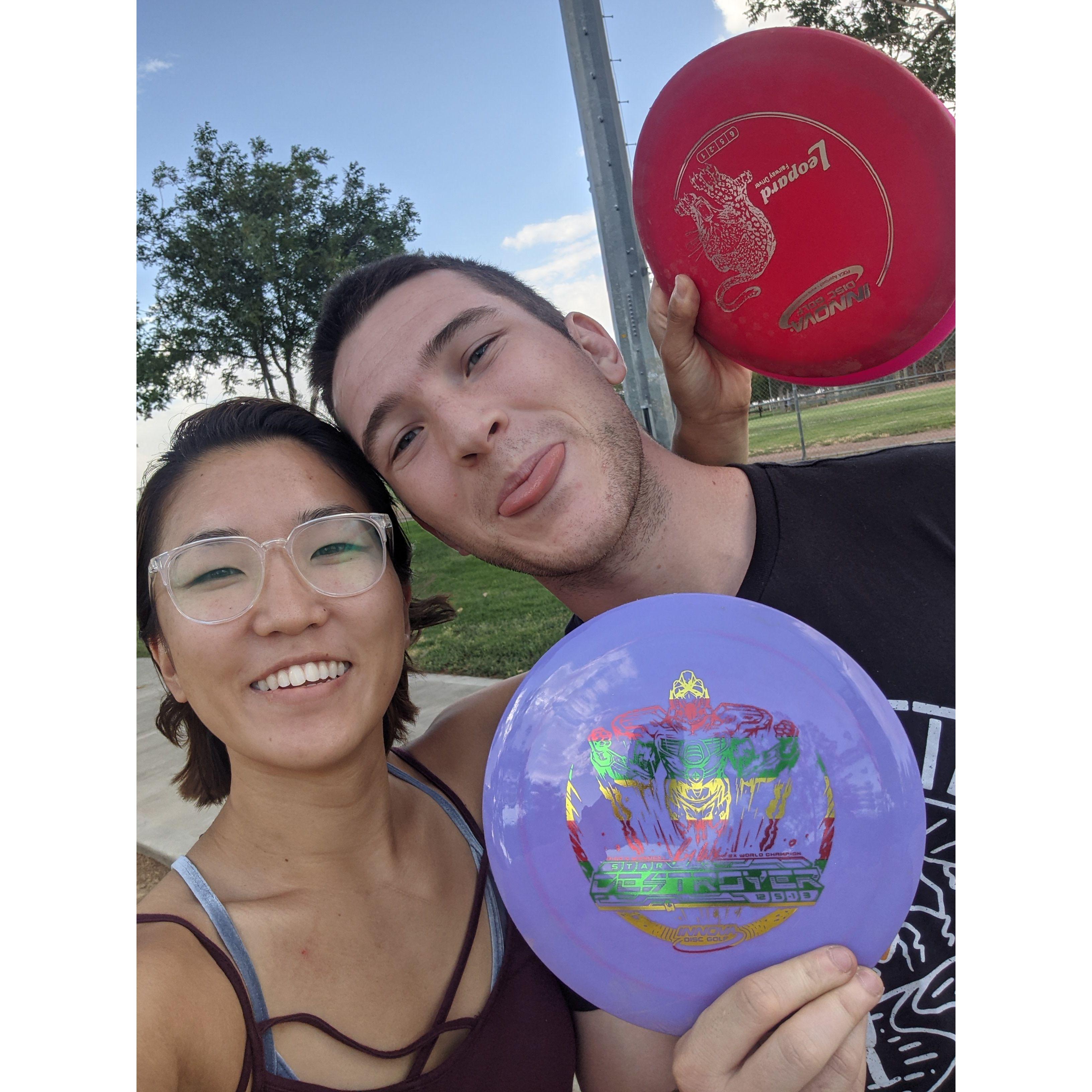 Teaching Esther to play disc golf.