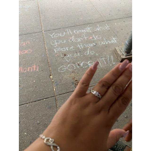 This just "happened" to be written on the sidewalk in chalk right where Damien proposed...