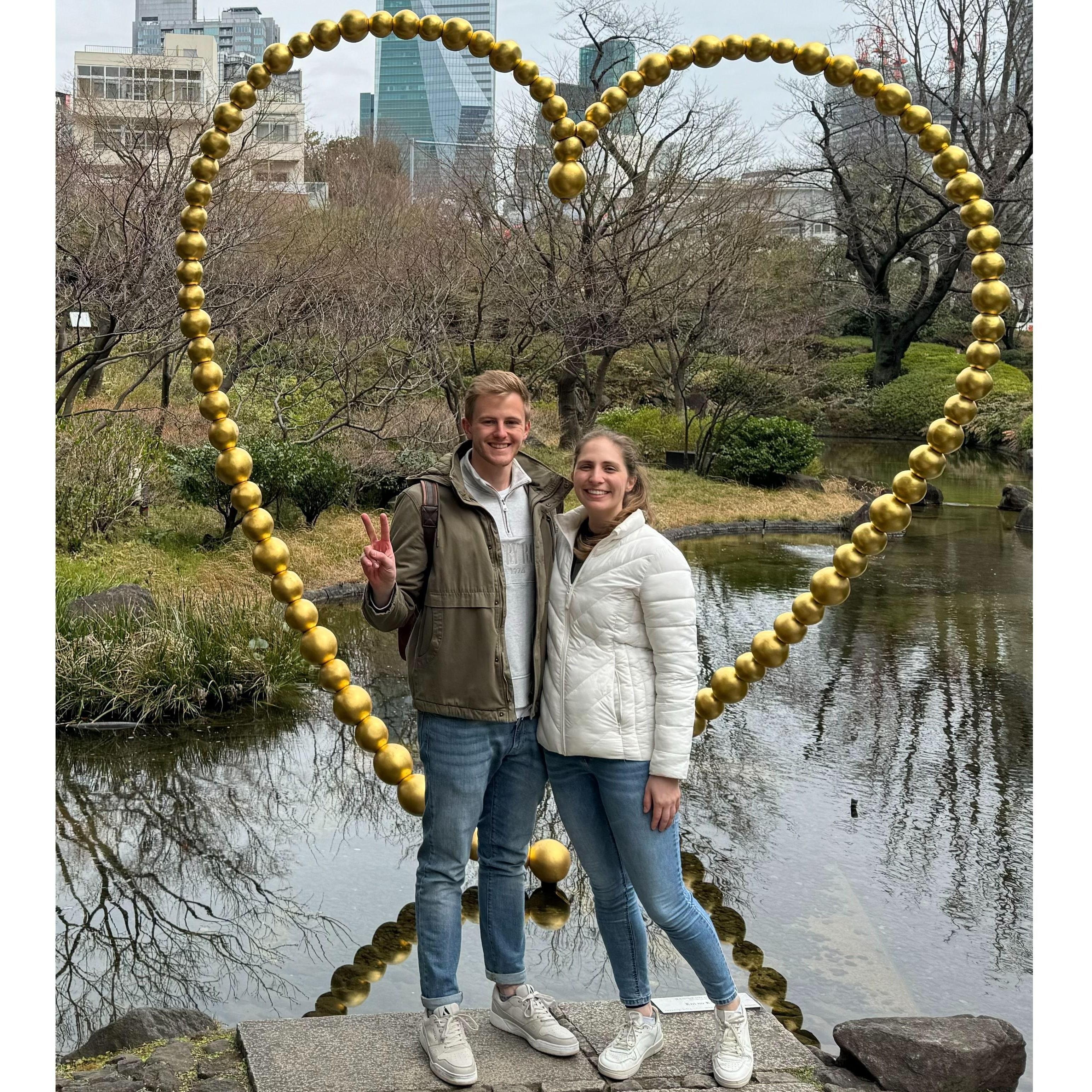 Posing in front of a sculpture in Tokyo