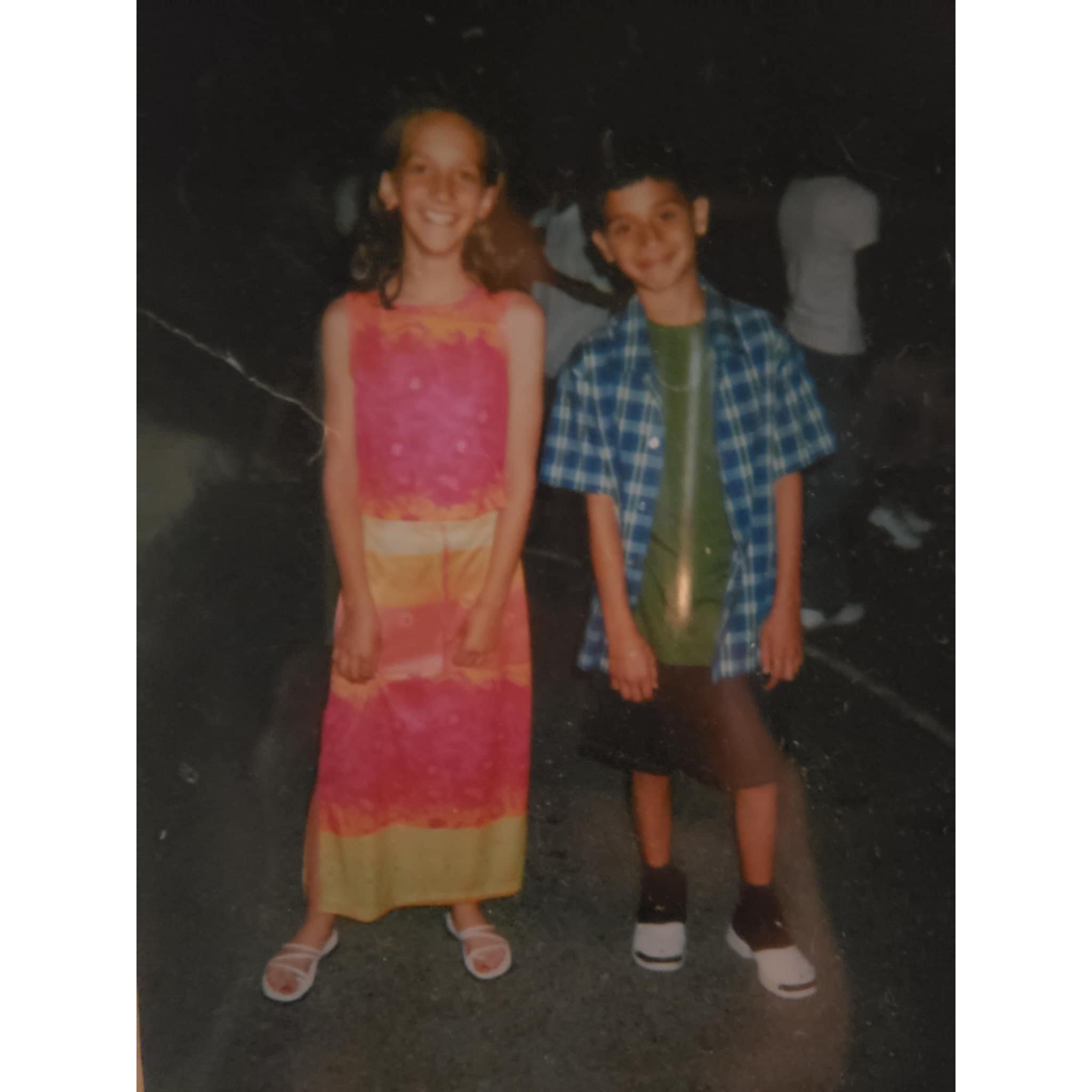 The very first photo together, forced by our Mom's at 5th grade graduation. While we despised one another, they were planning prom and our future marriage behind the camera