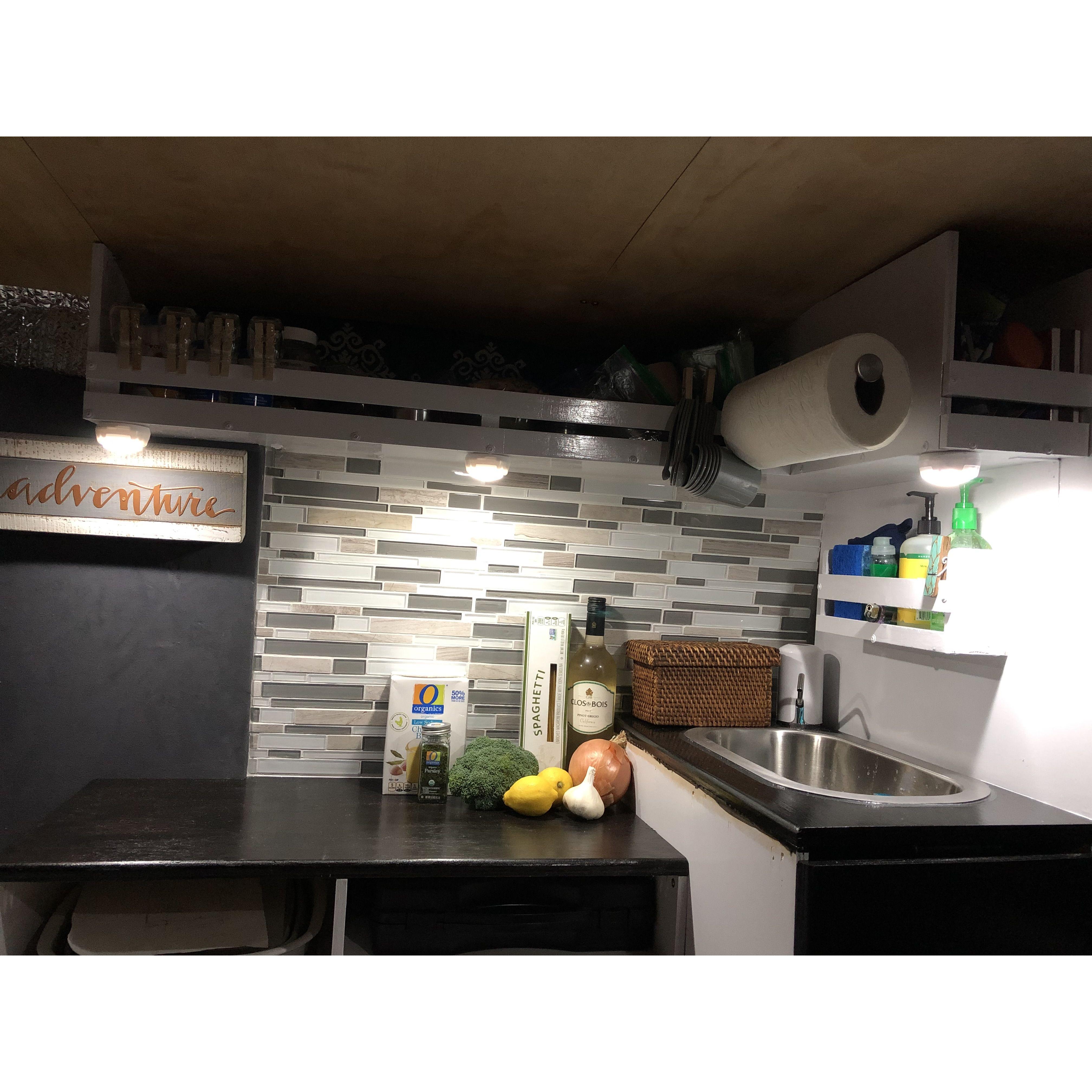 backsplash after!! we loved our little mini kitchen behind the drivers seat