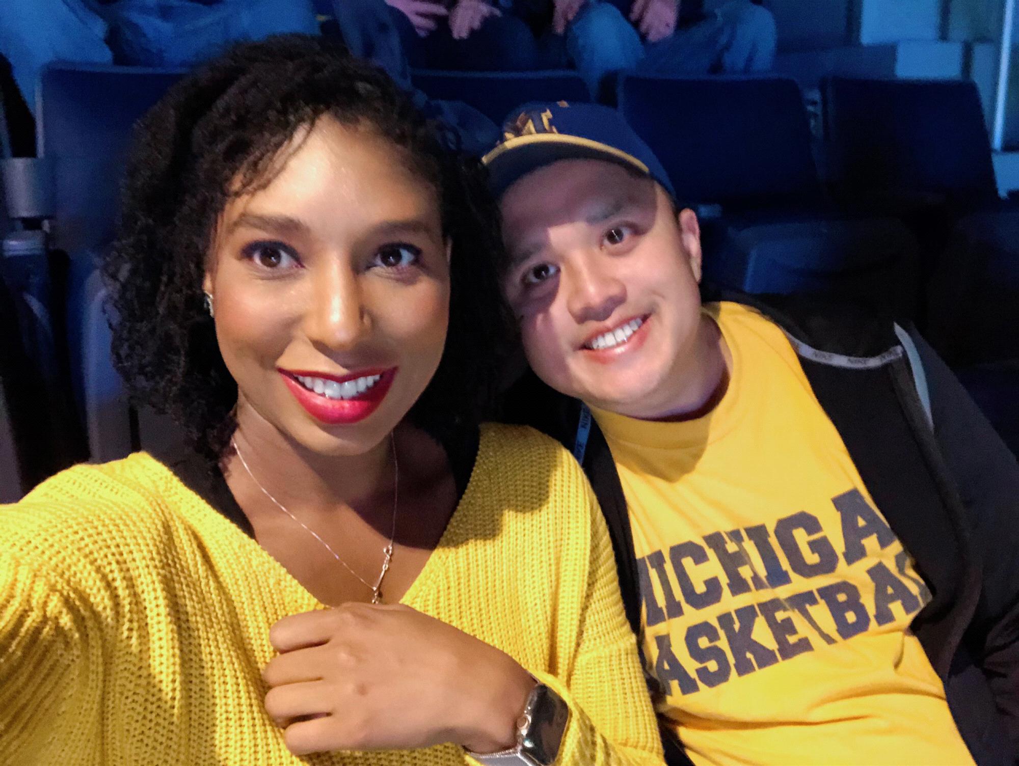 Enjoying a basketball game at that other school...