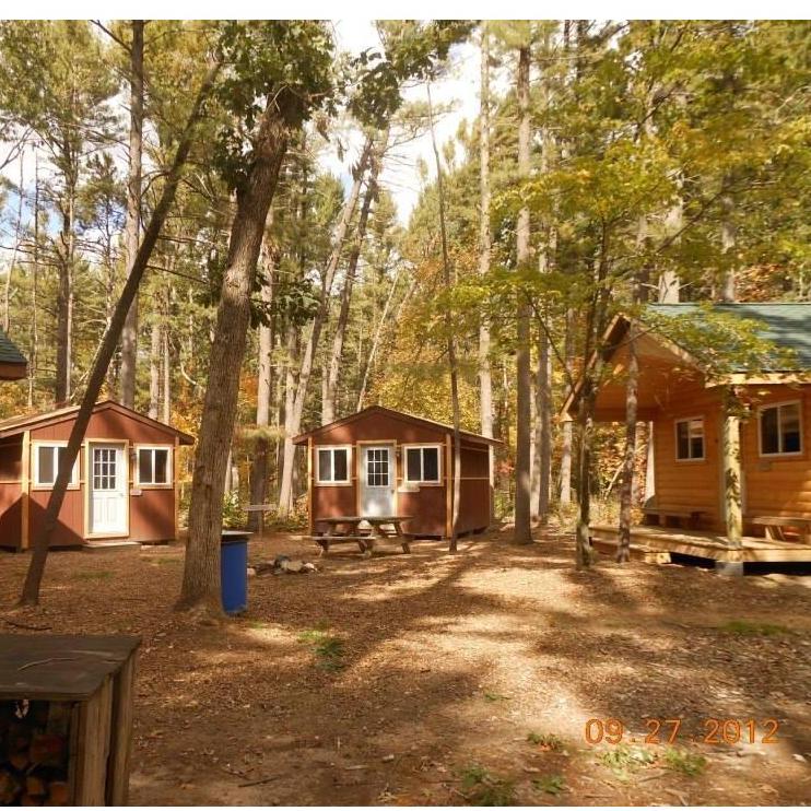 Larger cabin pictured is one of the "modern cabins". Smaller cabins are the "enhanced shells"