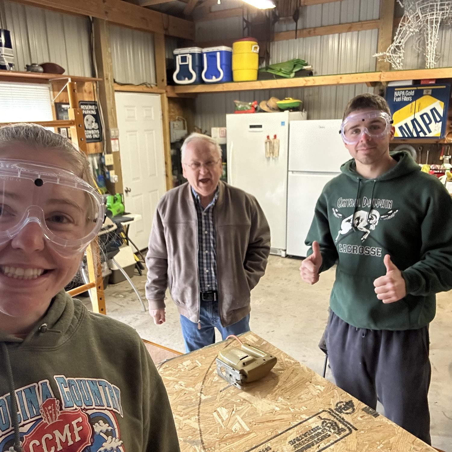Pappy teaching us how to use power tools and make the arch for our engagement party