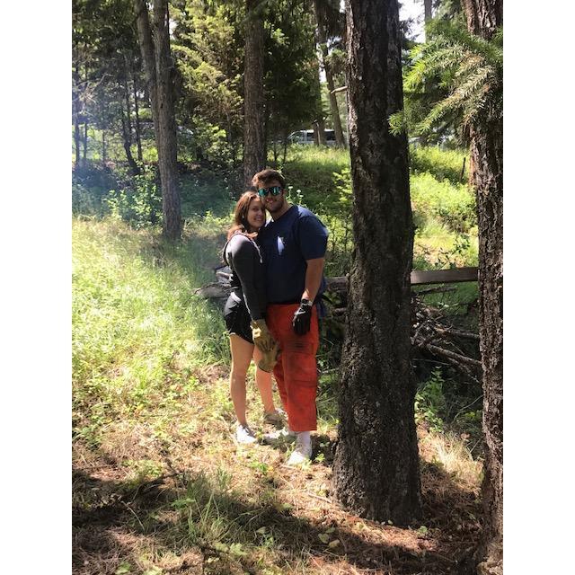 Out in the forest clearing dead trees and gathering fire wood.