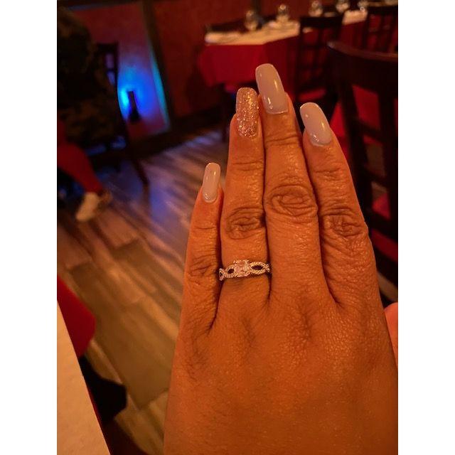 A close up of the engagement ring