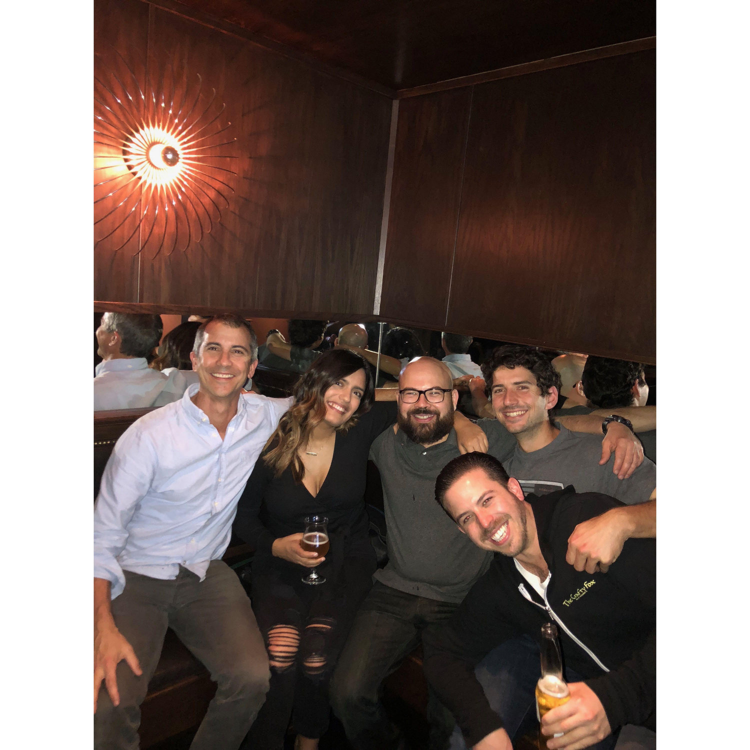 We met when we were both working at Hogwash - the place where people find true love. Here we are getting drinks with our favorite coworkers at Zeki's Bar.