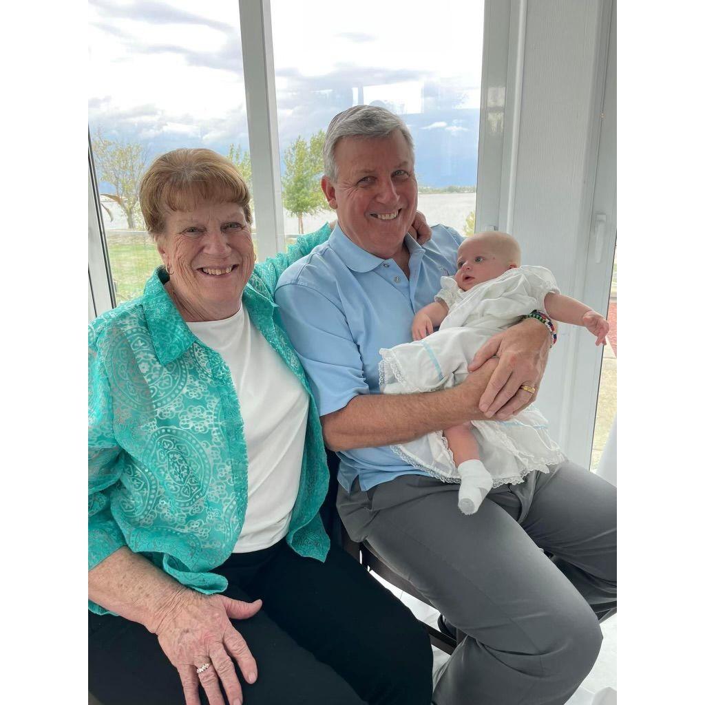 The Bride's Mommom and Poppop, holding her cousin Greyson