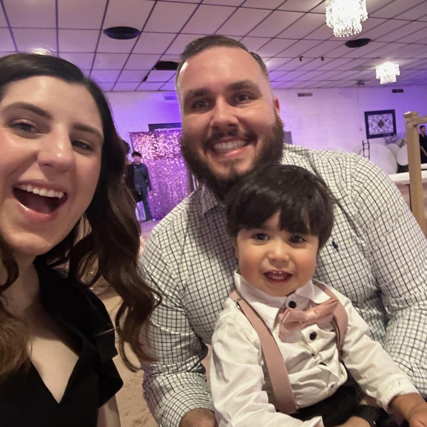 Us at Taylor's niece's quinceañera with our nephew, Niko