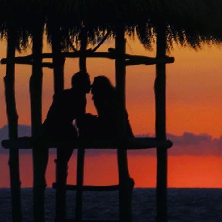 Our first International trip together- Puerto Vallarta, Mexico. We climbed the lifeguard tower and someone took our photo during sunset and sent it to us