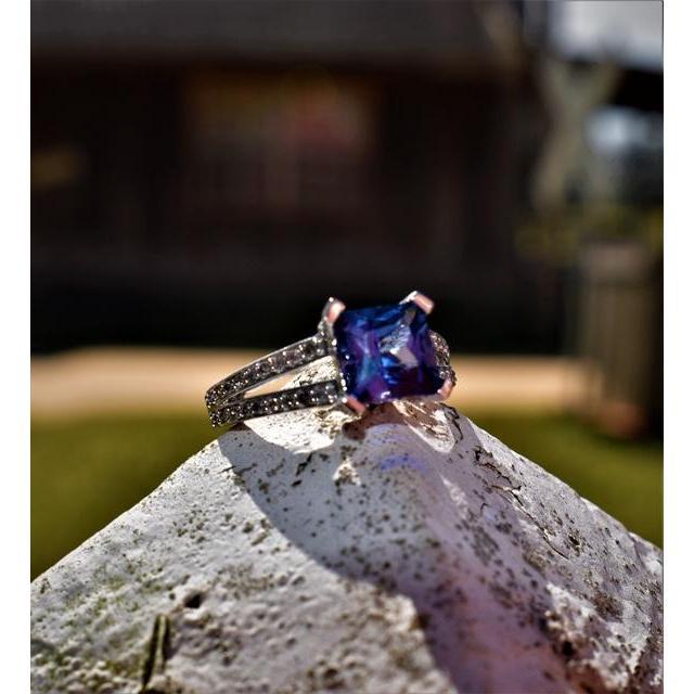 The ring is a sapphire and white gold beauty. Sapphire is the traditional engagement ring and also Kristi's birthstone. Steven designed the ring himself.