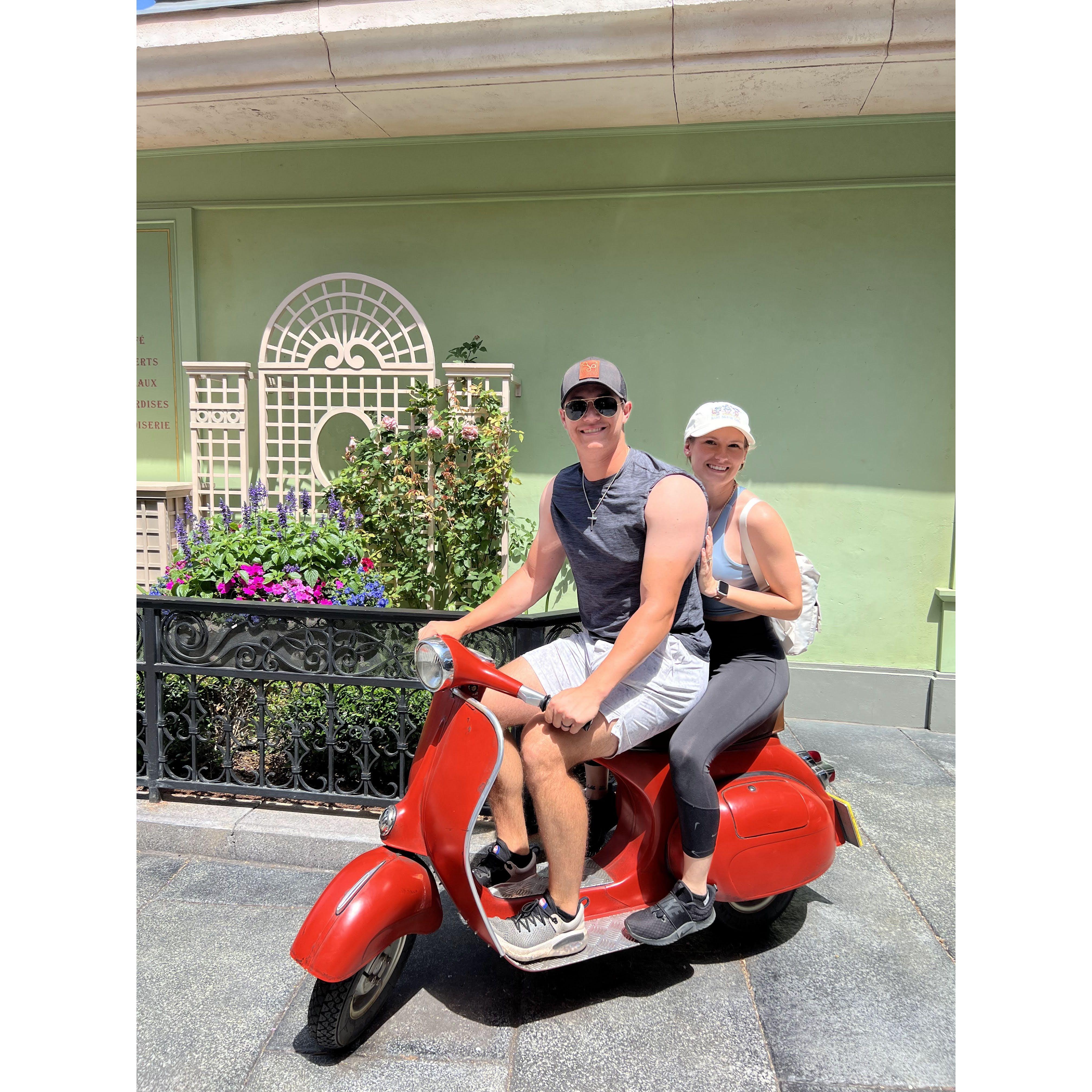 Pretending we're riding our Vespa around Epcot- our first theme park togehter