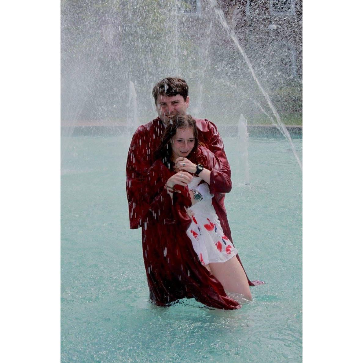 Jumping in the Fountains at Elon graduation. They couldn't kick us out at that point!