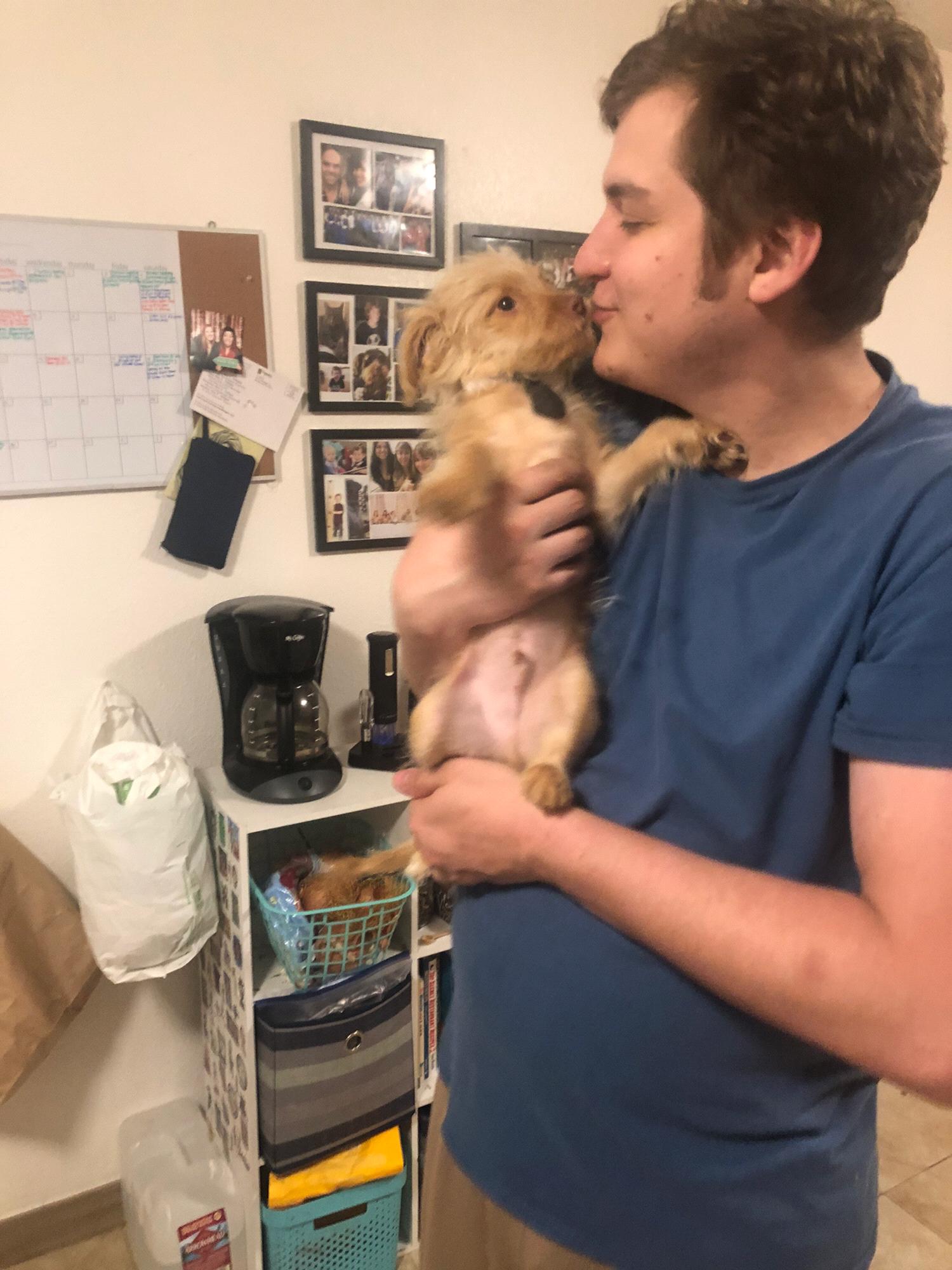 Conner and Charle, our dog, in our kitchen