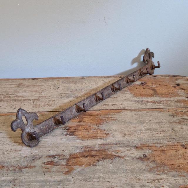 Antique French cast iron row of hooks.