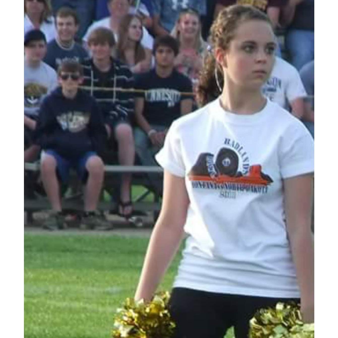 Our very first photo together. Even though we didn't know each other then, Jon was admiring Brittany from afar while watching her dance at a football game.
