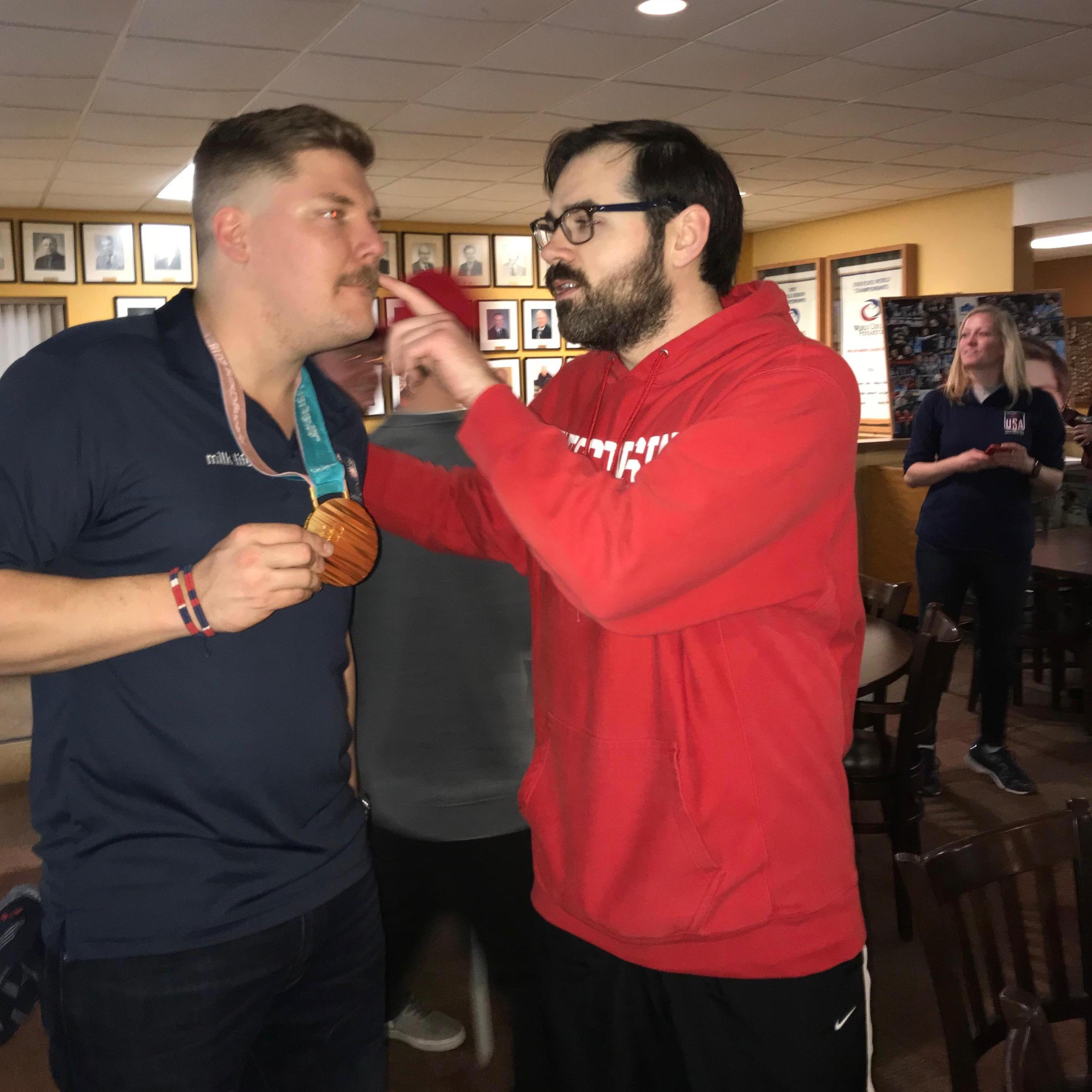 That is not Lindsay in the photo with Noah. It is Olympic Gold Medalist and Mustachioed Curler, Matt Hamilton, who was a great sport when Lindsay asked for this exact photo.