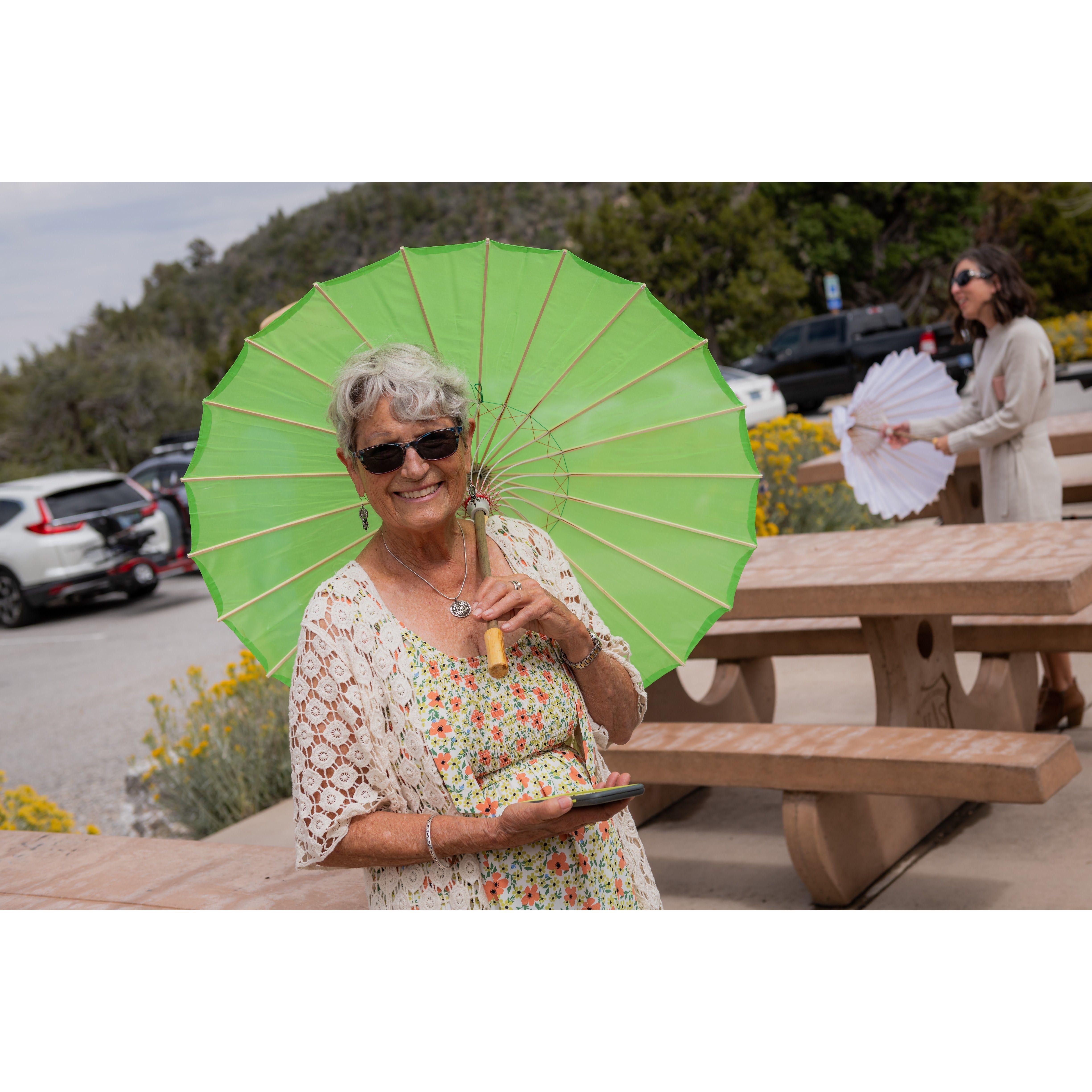 Tiaga picks the perfect parasol to complement her outfit.