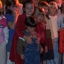 The oldest photo we could find with both of us in it! Dekalb homeschool group circa 2006. Leah looks down at Caleb squirming as Jude tries their best to hold him still.