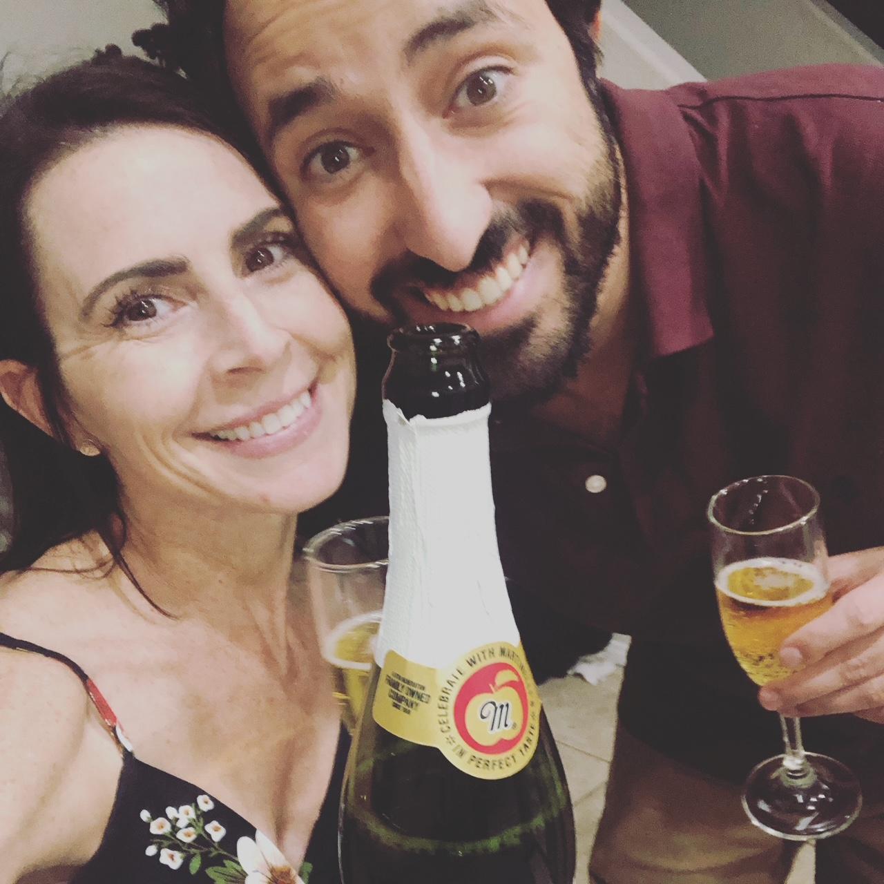 Celebrating 1 year of being together with a bottle of Martinelli's Sparking Cider!