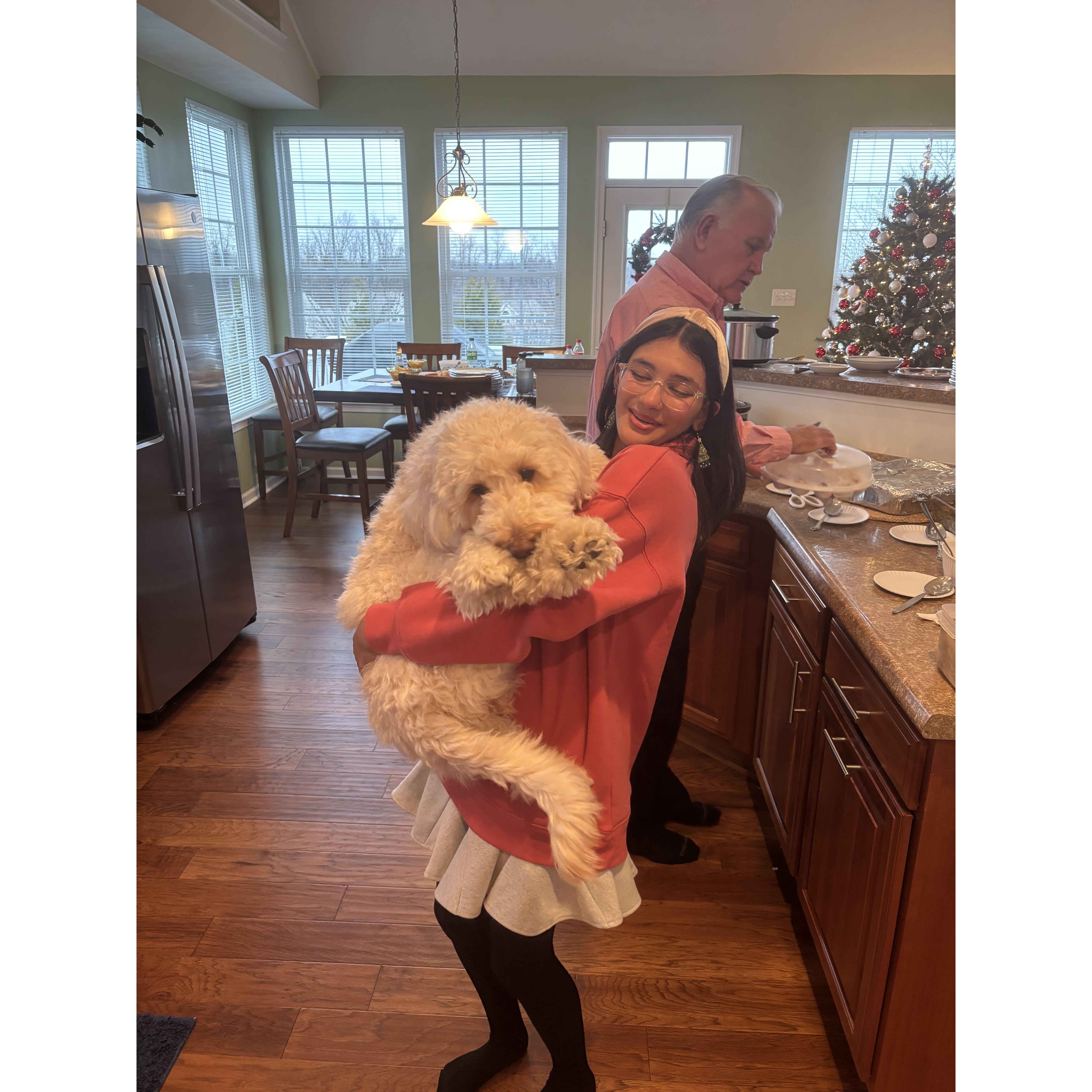 Maya holding the little baby at Christmas