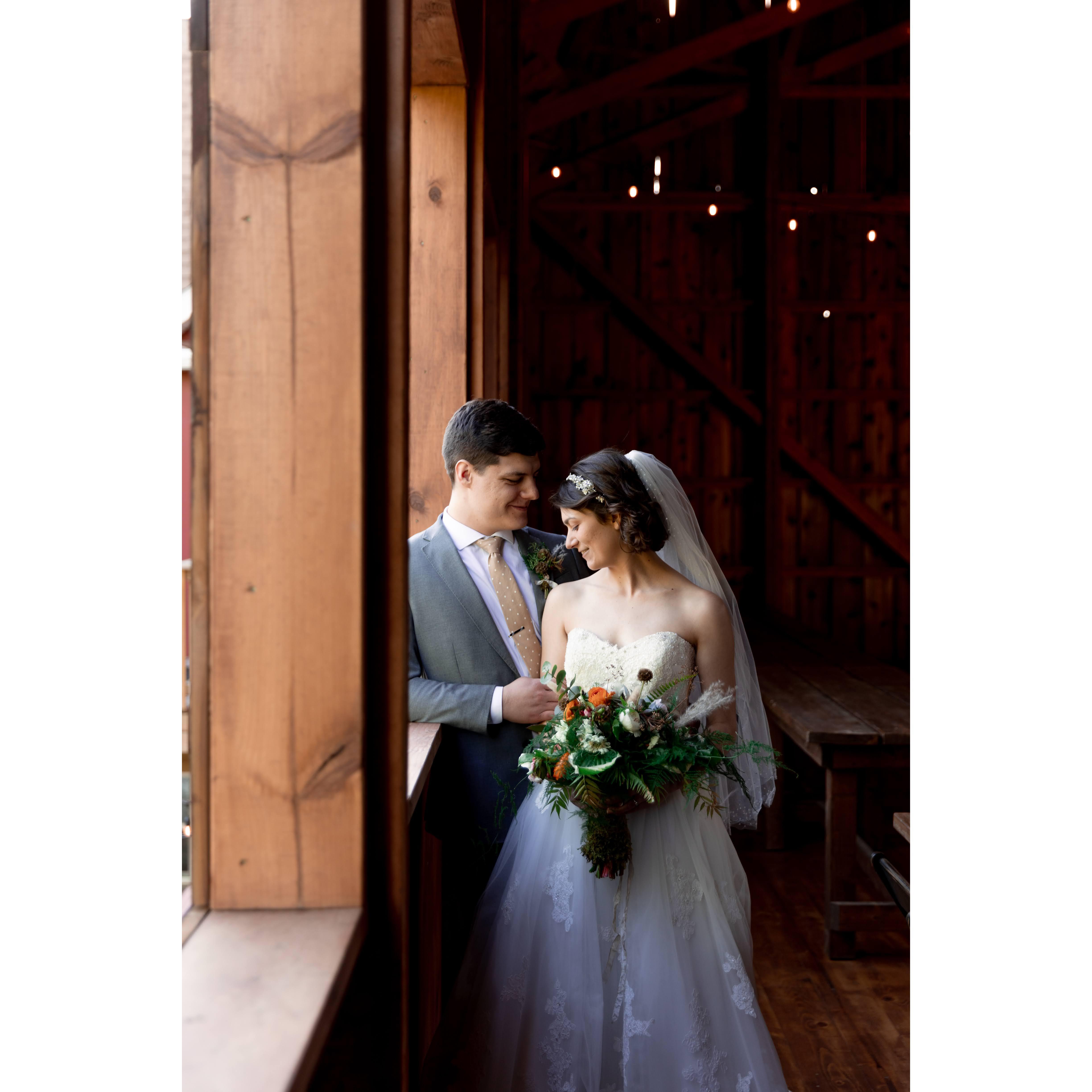 Summer, 2021. We may have gotten free wedding photos to advertise a venue opening nearby- so no, this is not Lauren's dress or boquet or our venue. We got to eat cake though, so pretty cool anyway.