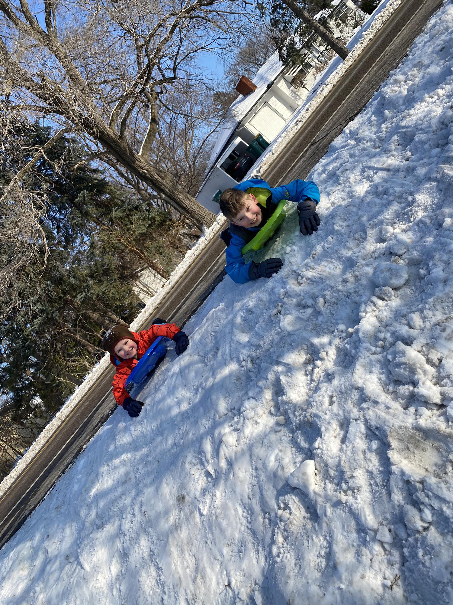 The bride will battle the snow for a few reasons…seeing their enjoyment playing is one of them!