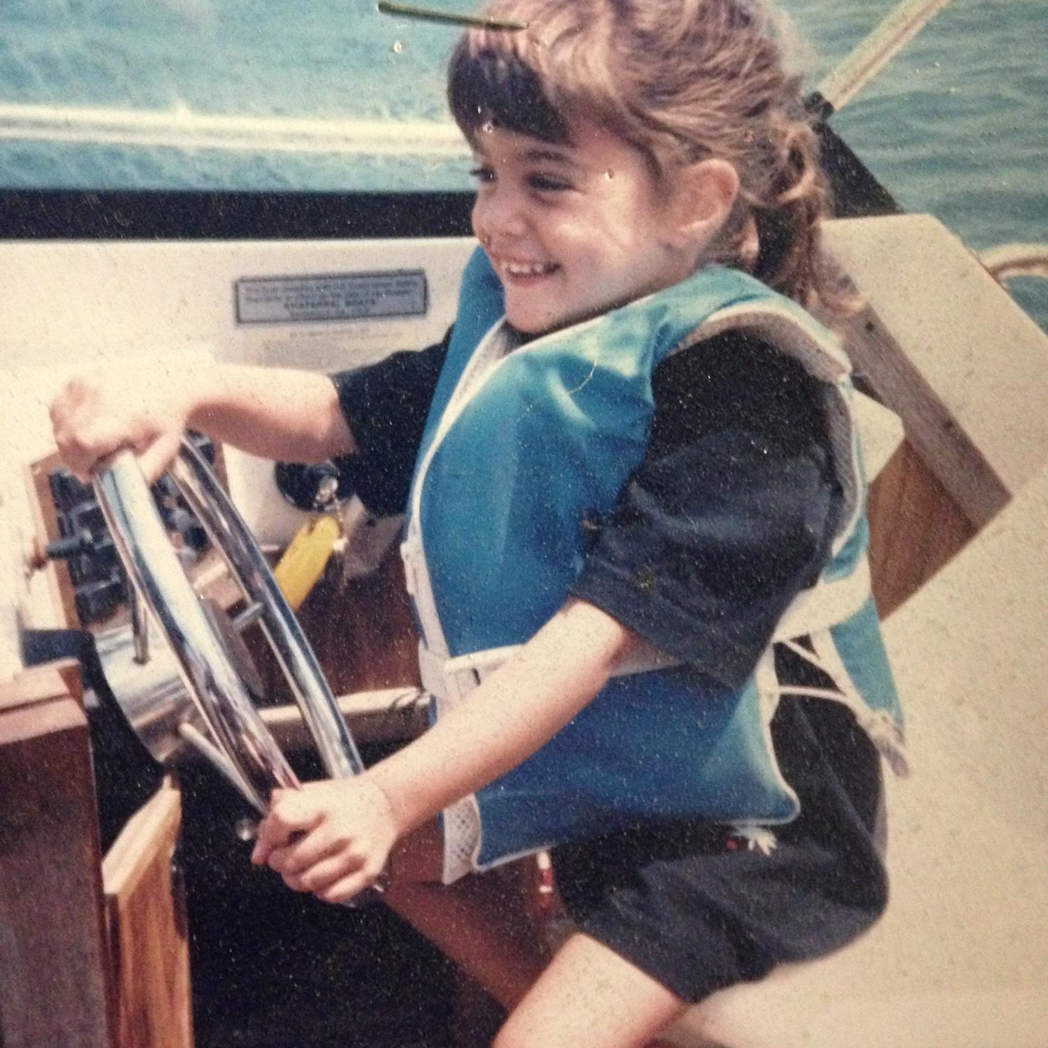 tiny tina taking the boat for a spin.